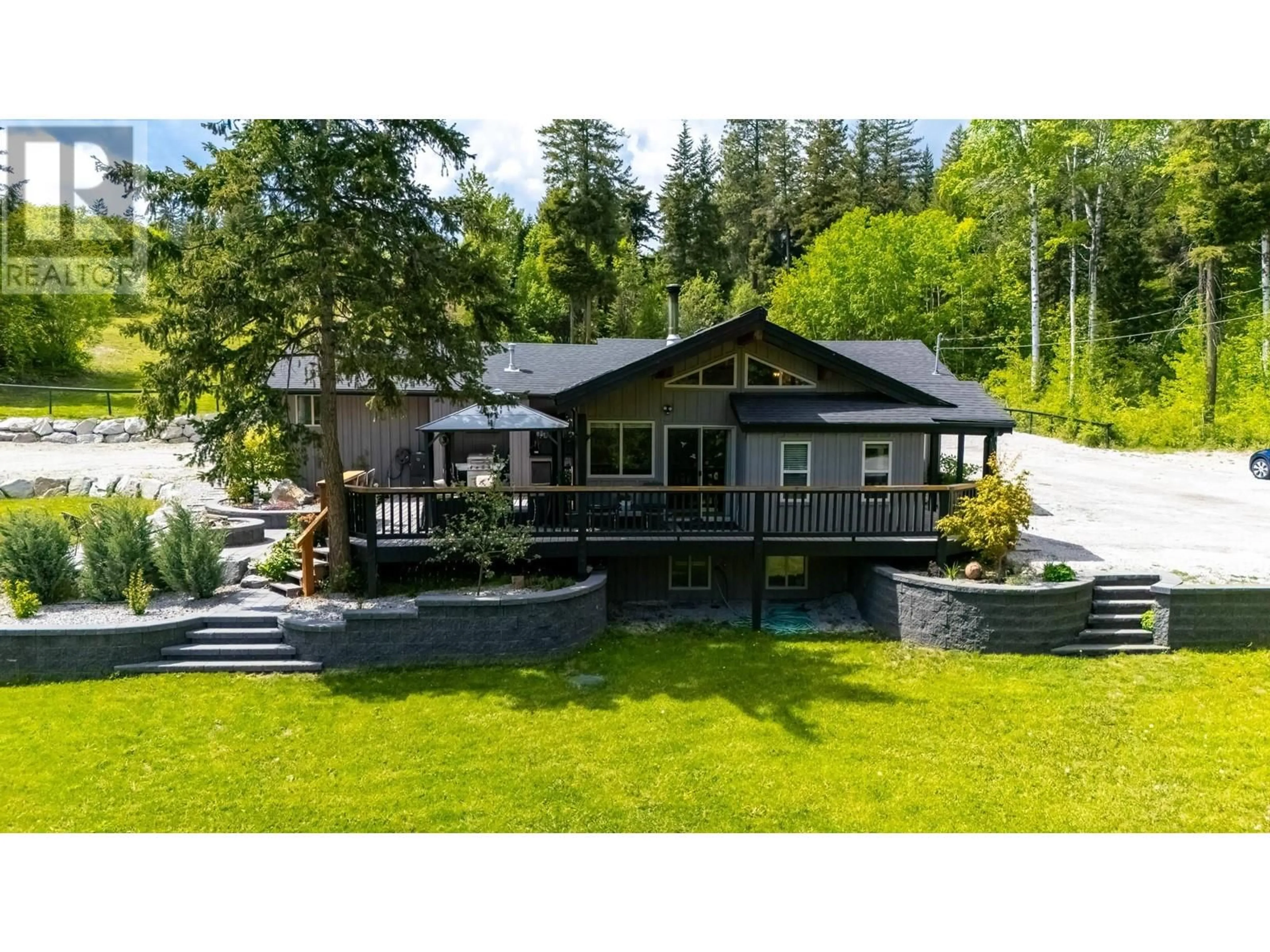 A pic from outside/outdoor area/front of a property/back of a property/a pic from drone, unknown for 3402 MCKELLAR ROAD, West Kelowna British Columbia V4T1W1