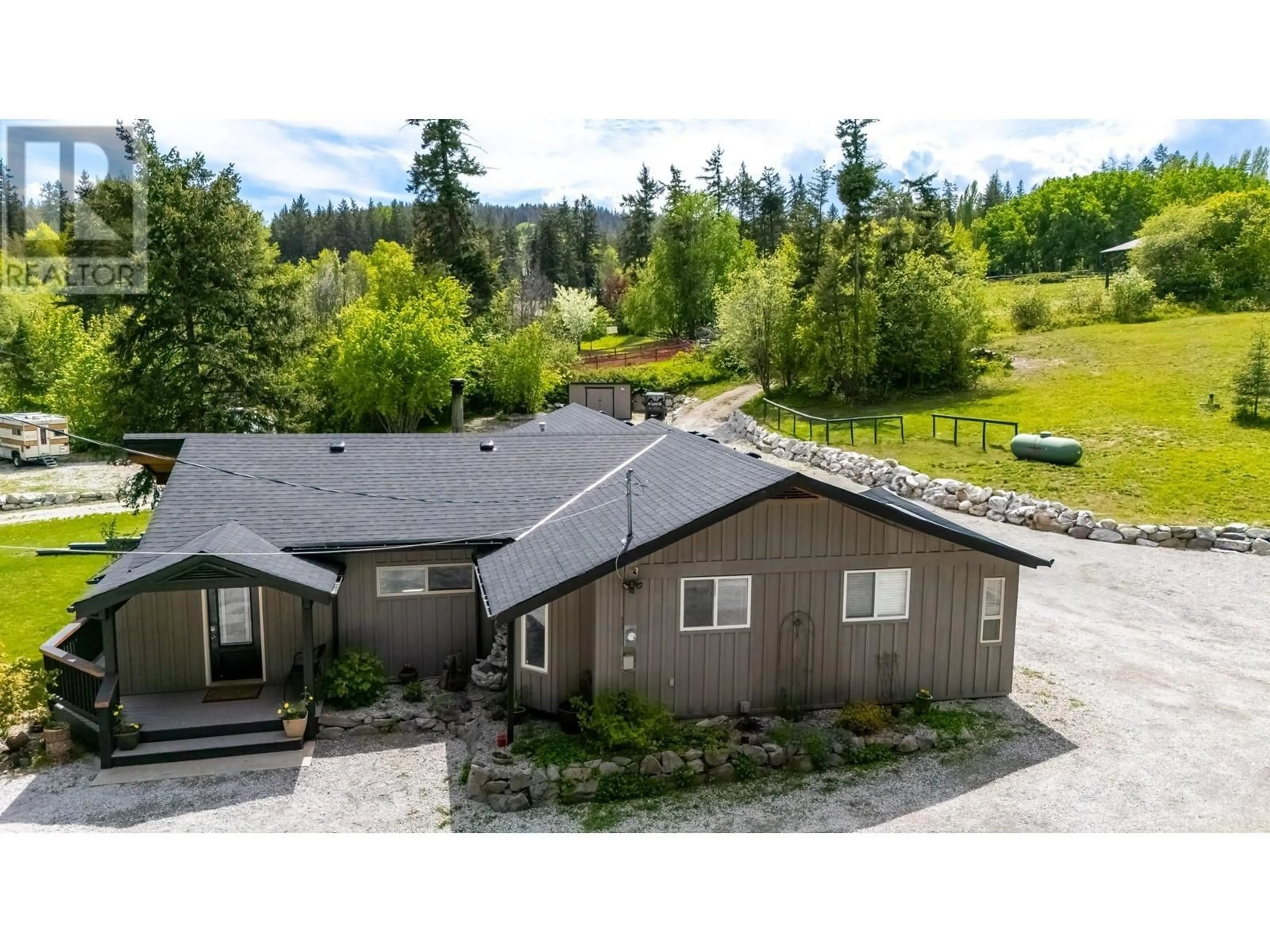 A pic from outside/outdoor area/front of a property/back of a property/a pic from drone, mountain view for 3402 MCKELLAR ROAD, West Kelowna British Columbia V4T1W1