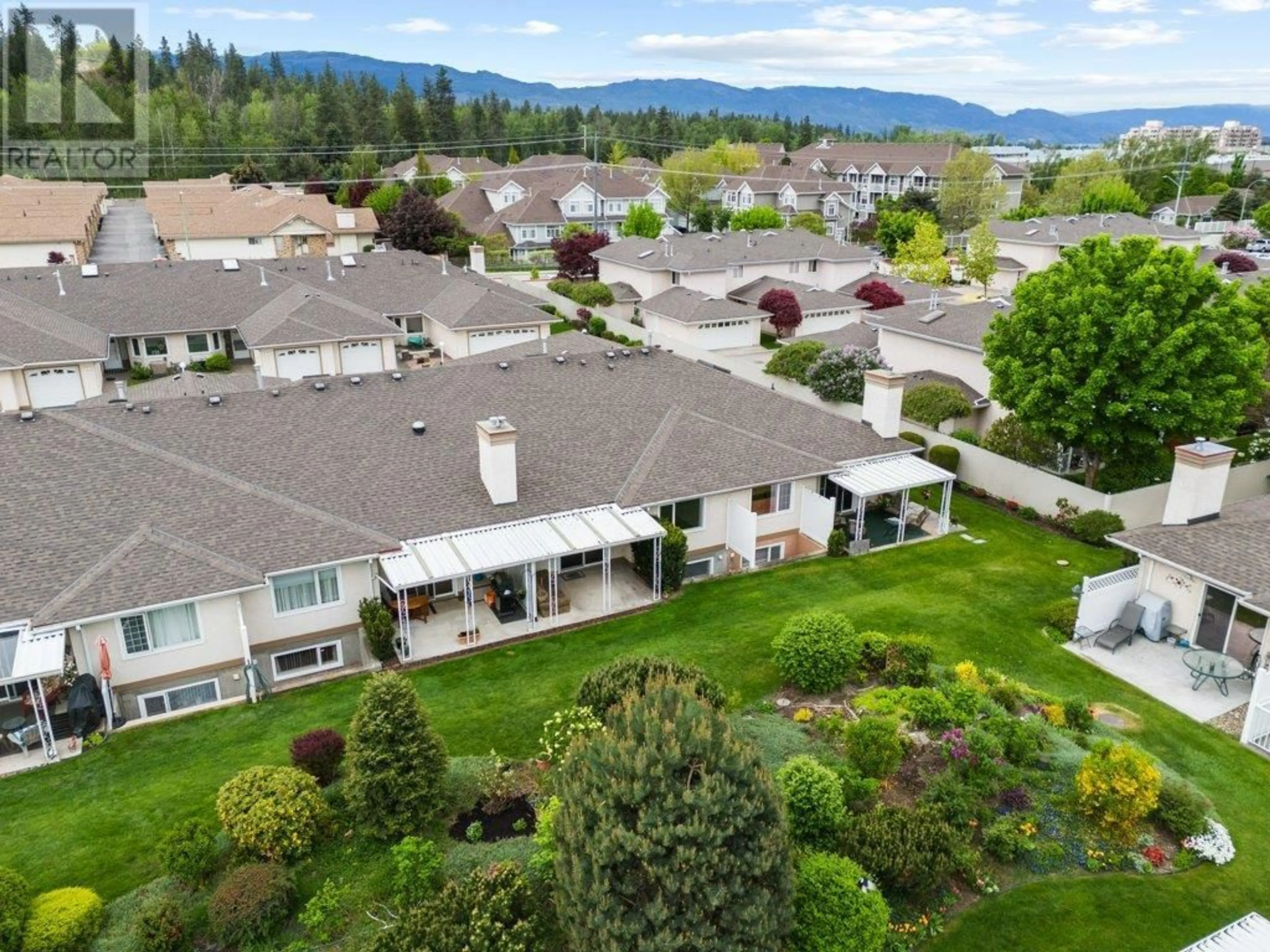 A pic from outside/outdoor area/front of a property/back of a property/a pic from drone, mountain view for 7 - 1874 PARKVIEW CRESCENT, Kelowna British Columbia V1X7G6