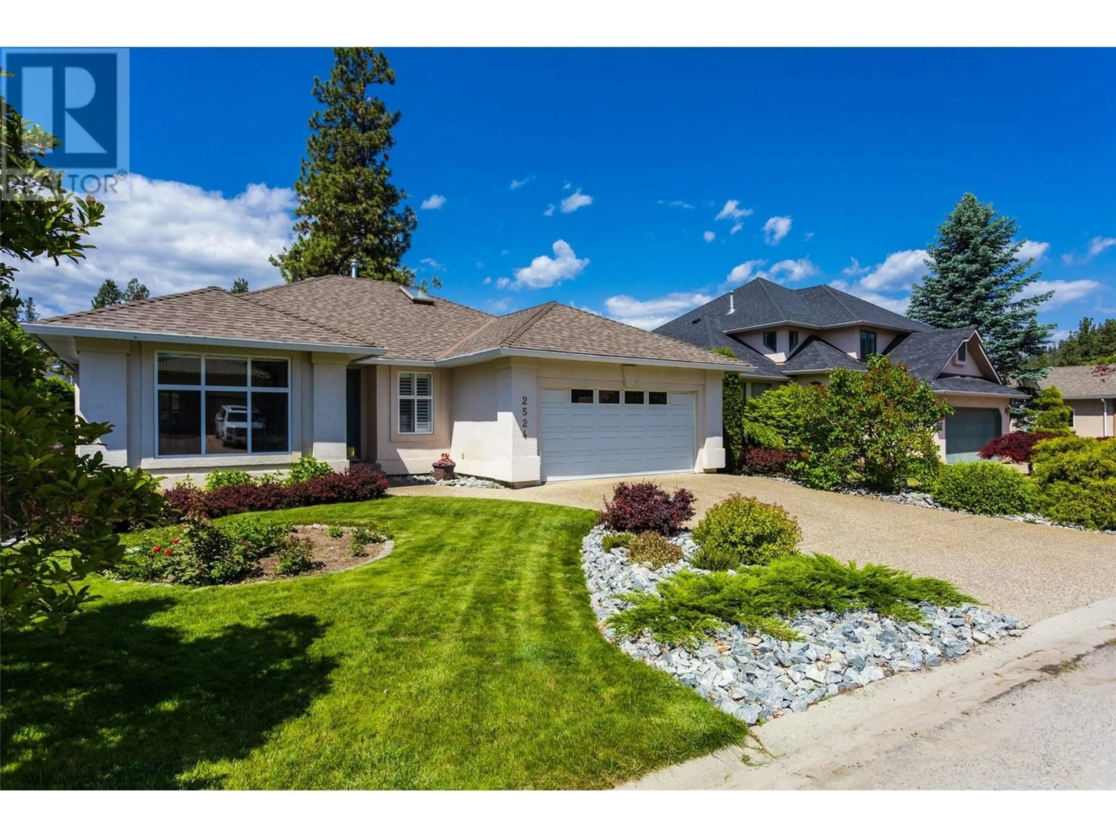 Home with vinyl exterior material, street for 2524 QUAIL LANE, Kelowna British Columbia V1V1Z9