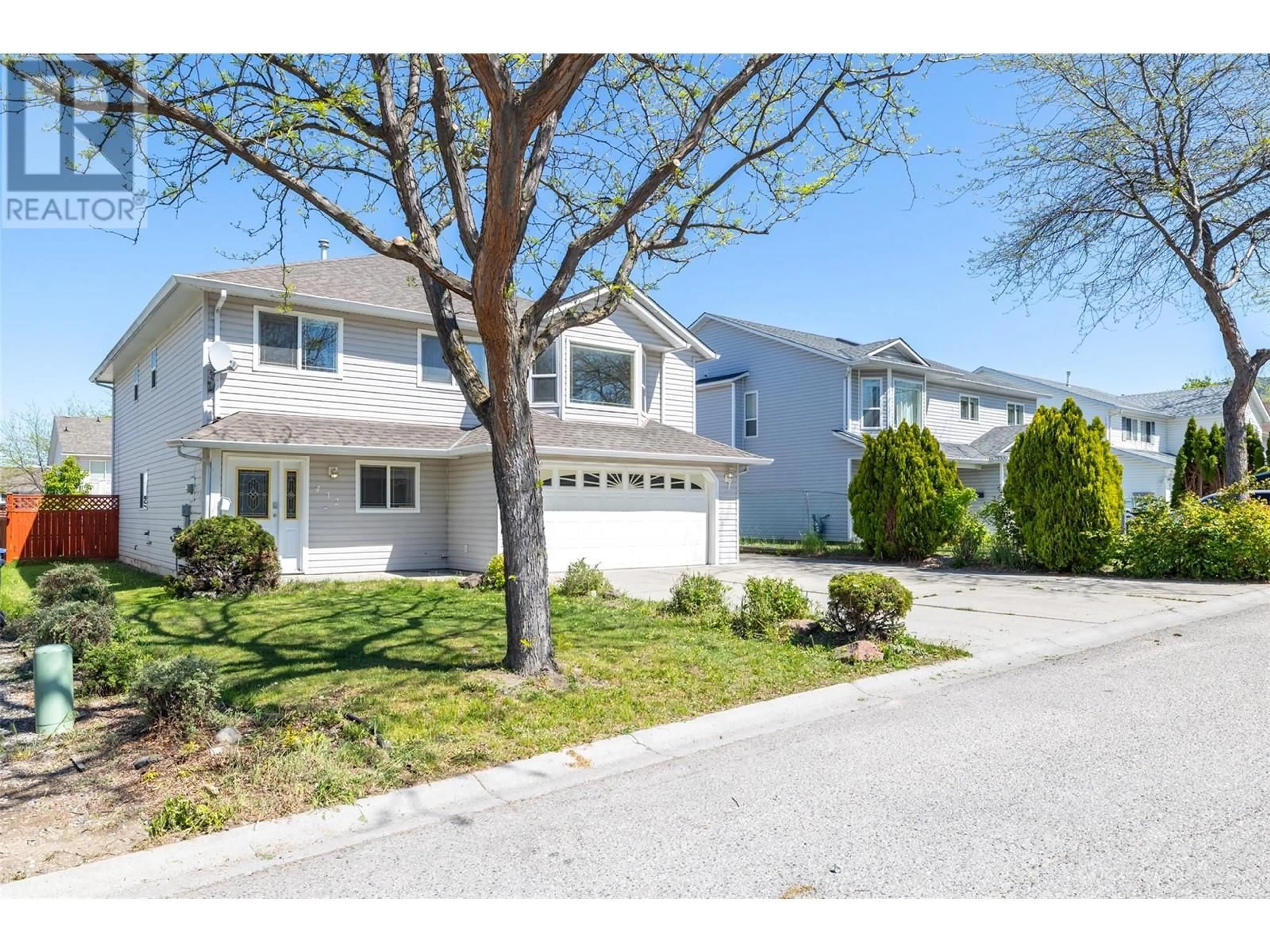 Home with vinyl exterior material, street for 412 MCLENNAN CRESCENT, Kelowna British Columbia V1X7M9