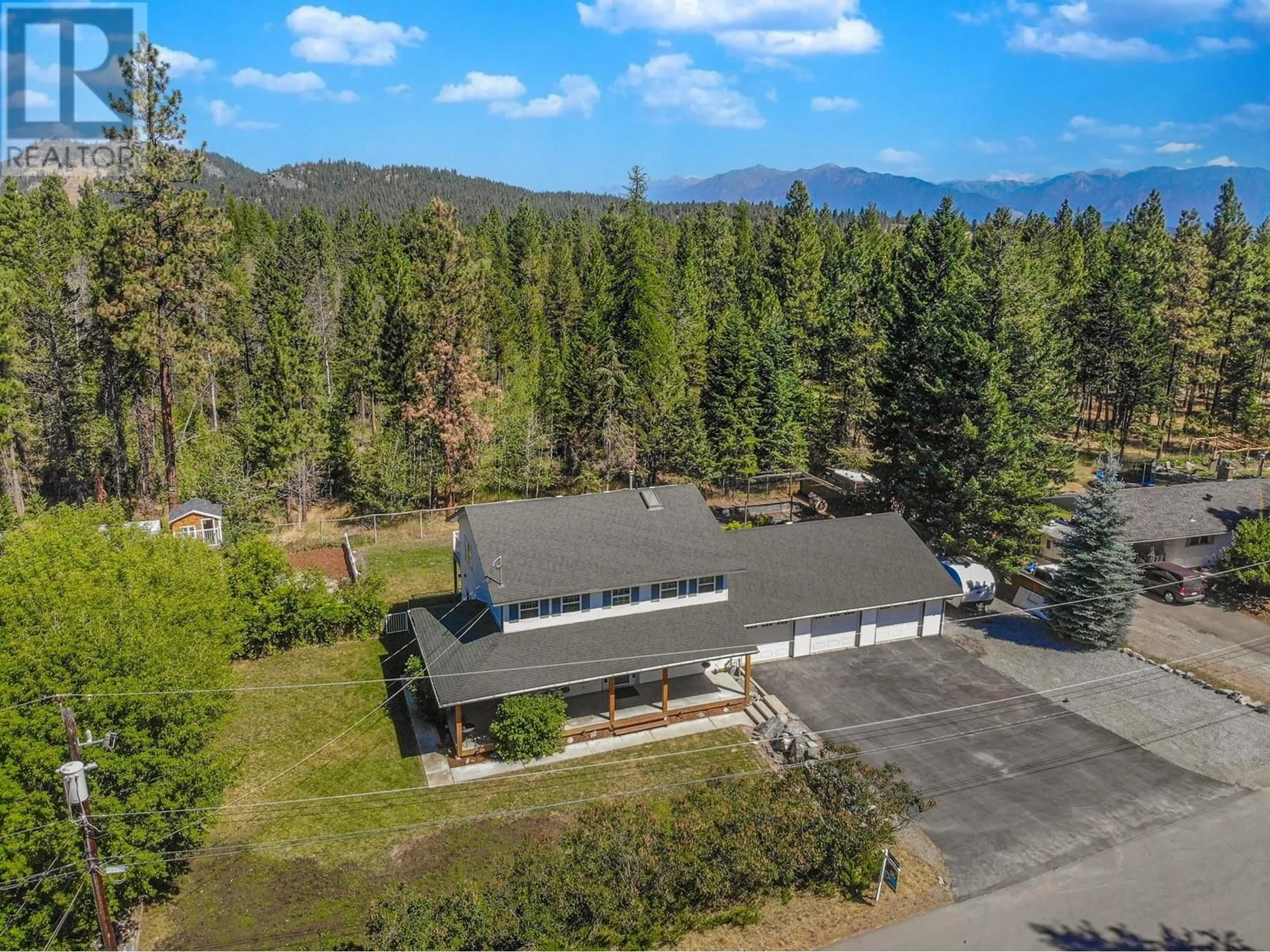 A pic from outside/outdoor area/front of a property/back of a property/a pic from drone, mountain view for 512 WILDWOOD DRIVE, Cranbrook British Columbia V1C6V1