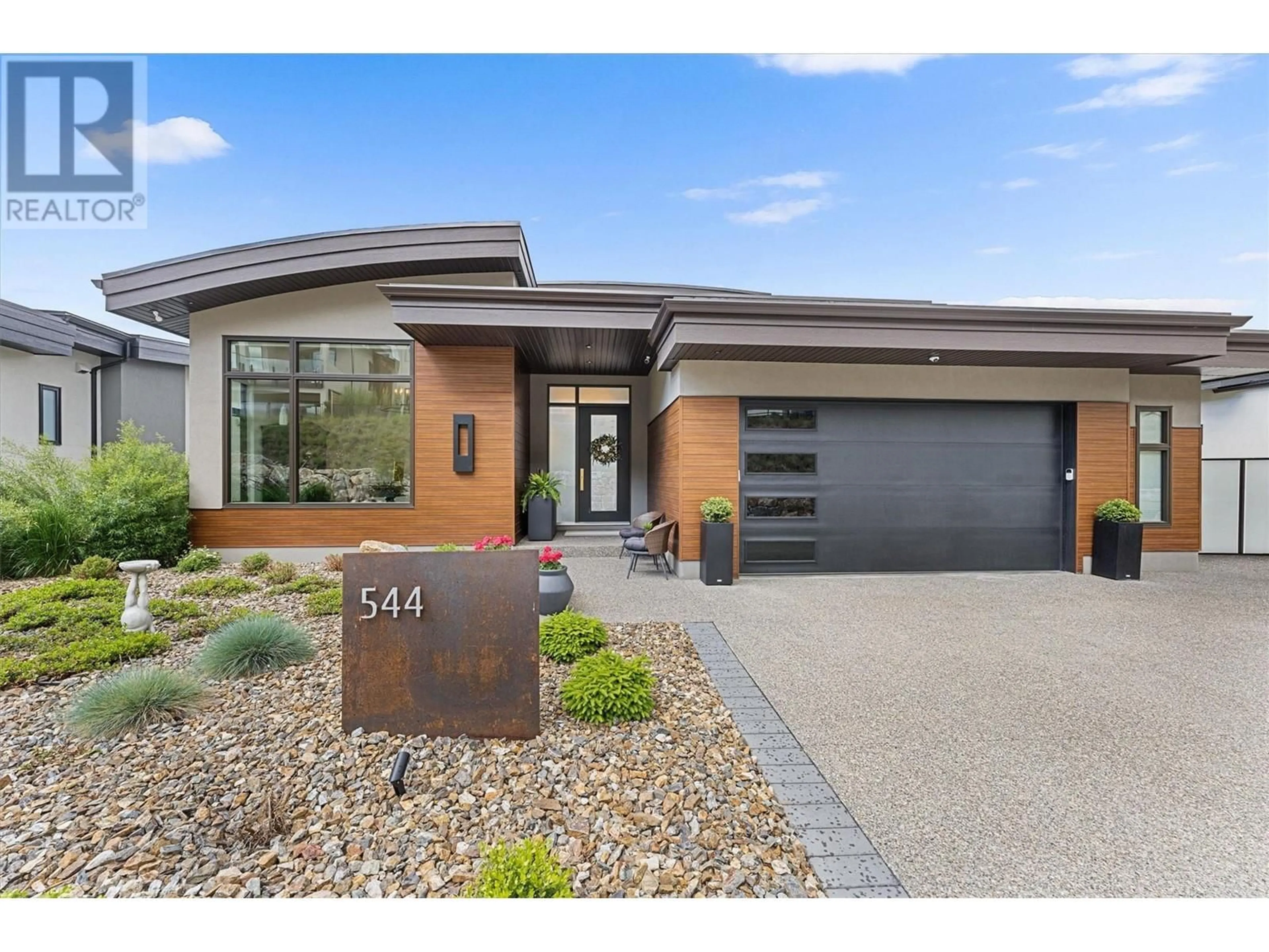 Home with brick exterior material, street for 544 CLIFTON LANE, Kelowna British Columbia V1V0B7