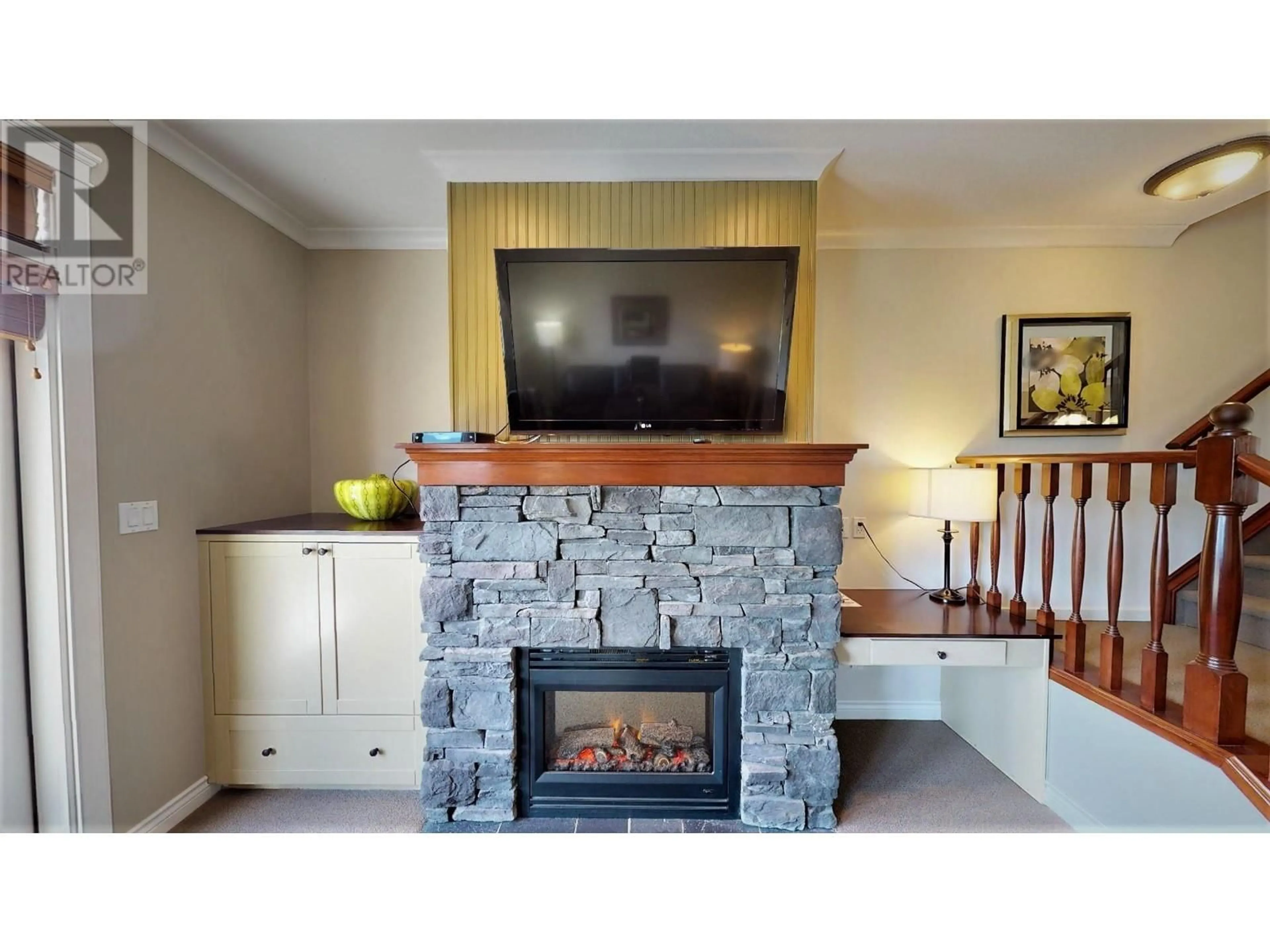 Living room with furniture, wood/laminate floor for 234 A - 200 BIGHORN BOULEVARD, Radium Hot Springs British Columbia V0A1M0