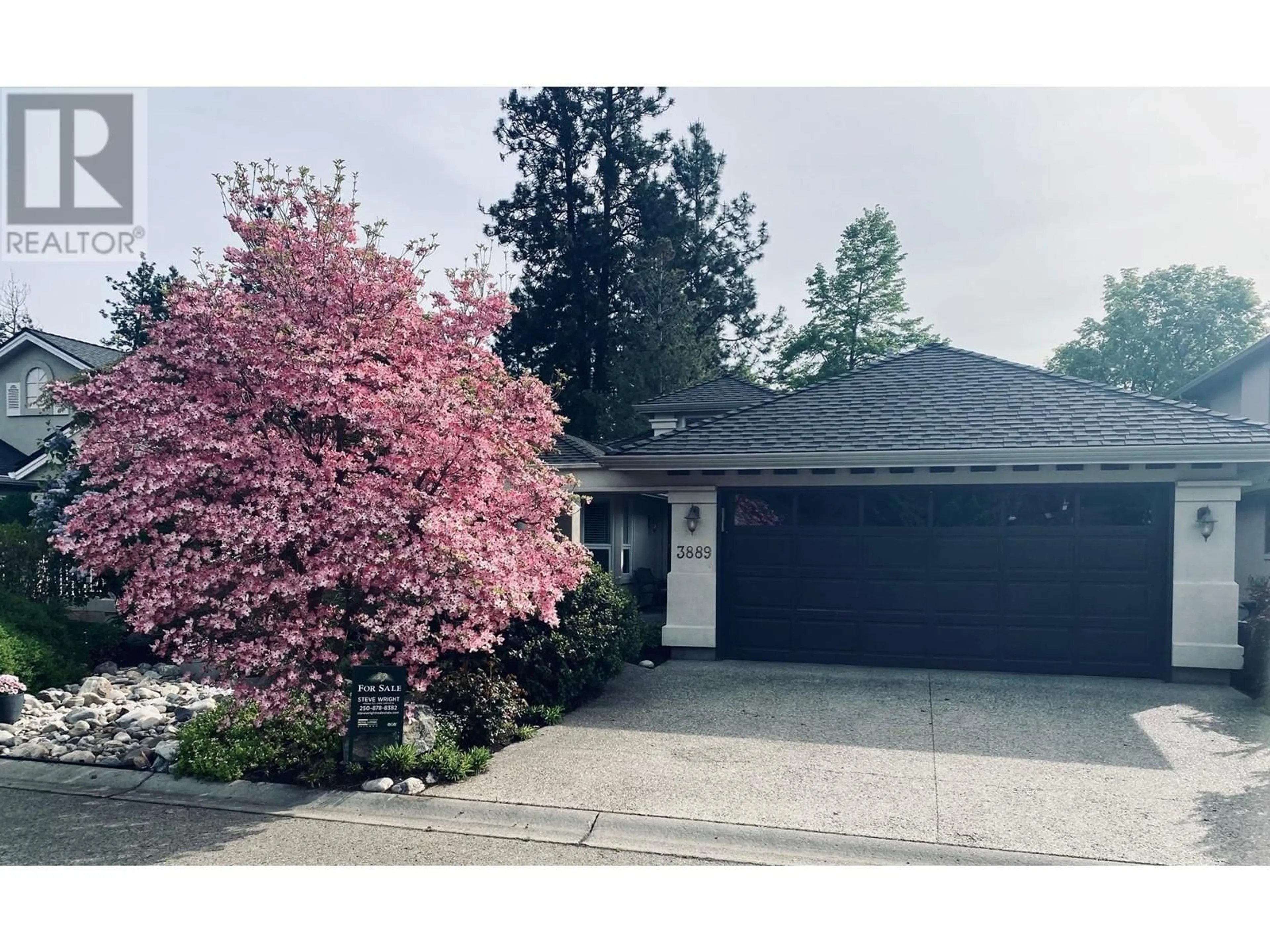 Home with vinyl exterior material, street for 3889 GALLAGHERS OTHER, Kelowna British Columbia V1W3Z9