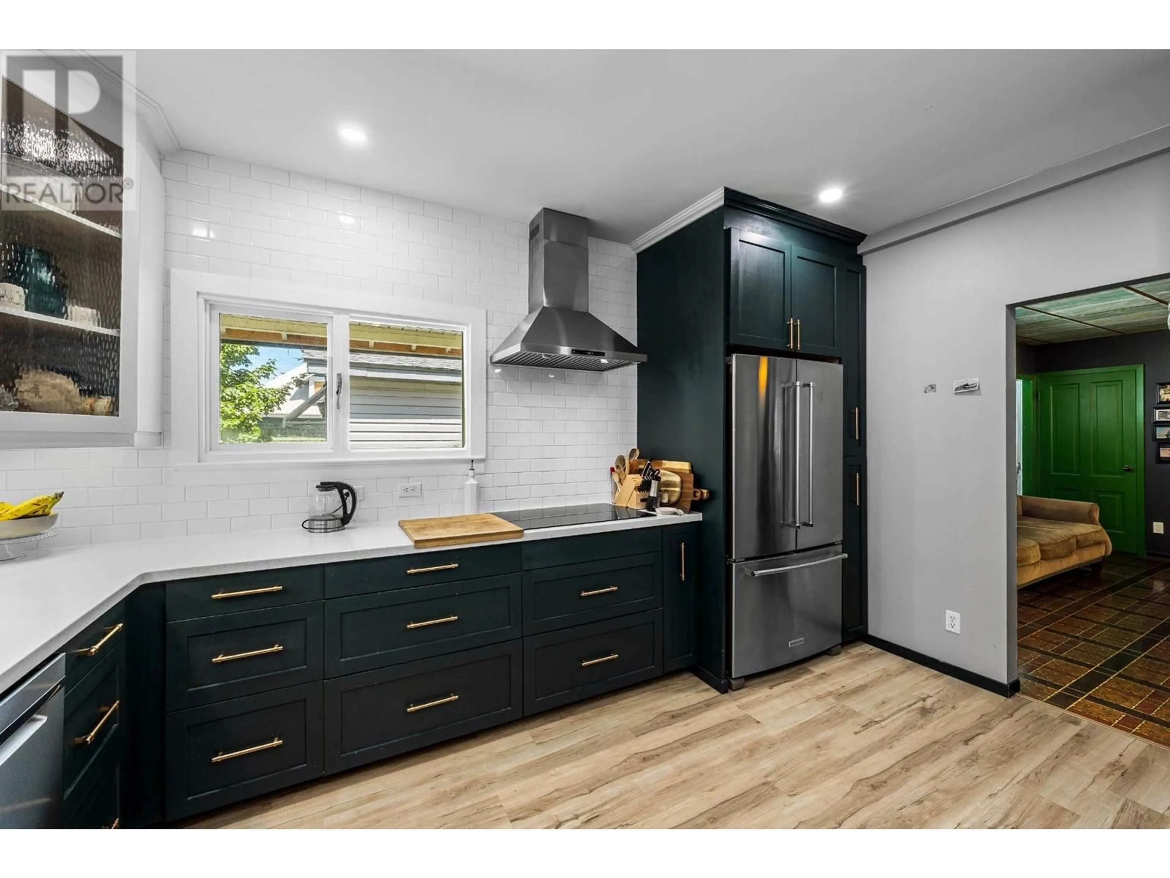 Open concept kitchen, wood/laminate floor for 511 BRINK STREET, Ashcroft British Columbia V0K1A0