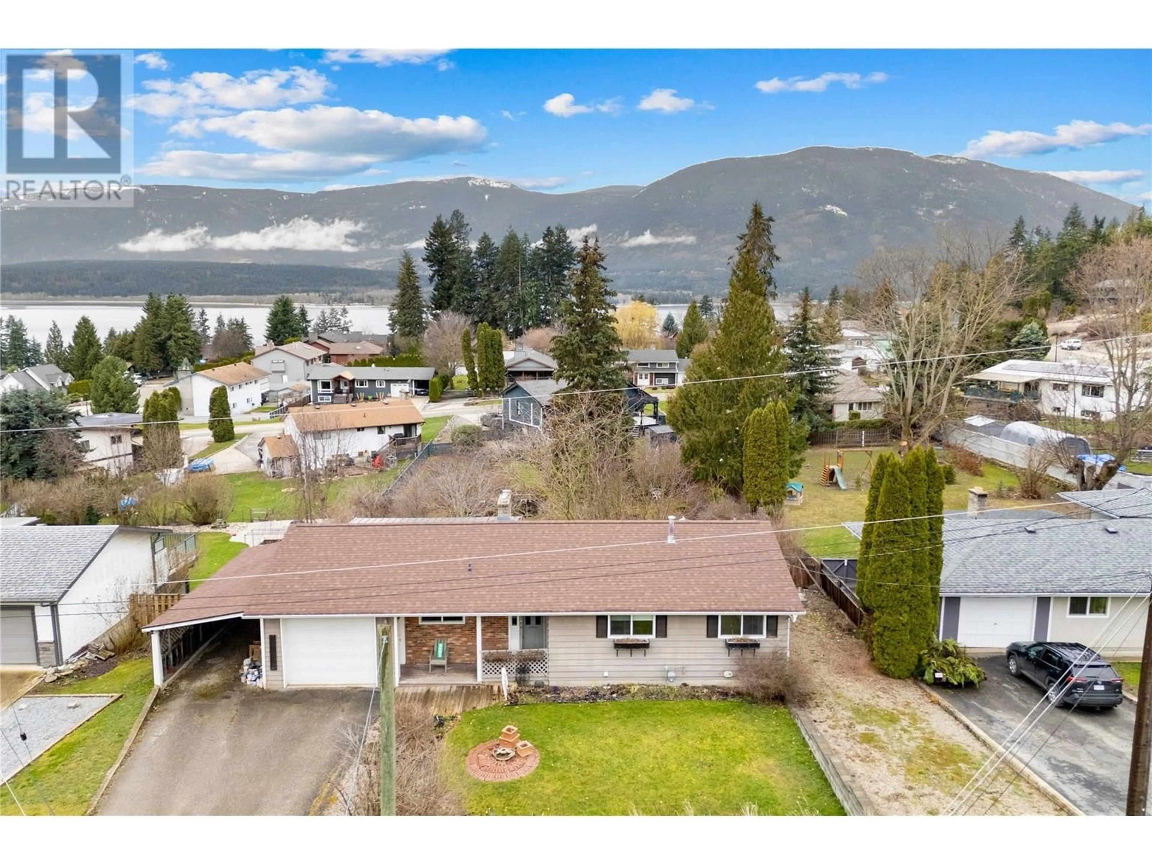 A pic from outside/outdoor area/front of a property/back of a property/a pic from drone, water/lake/river/ocean view for 5091 LAKESHORE ROAD NORTHEAST, Salmon Arm British Columbia V1E3P4