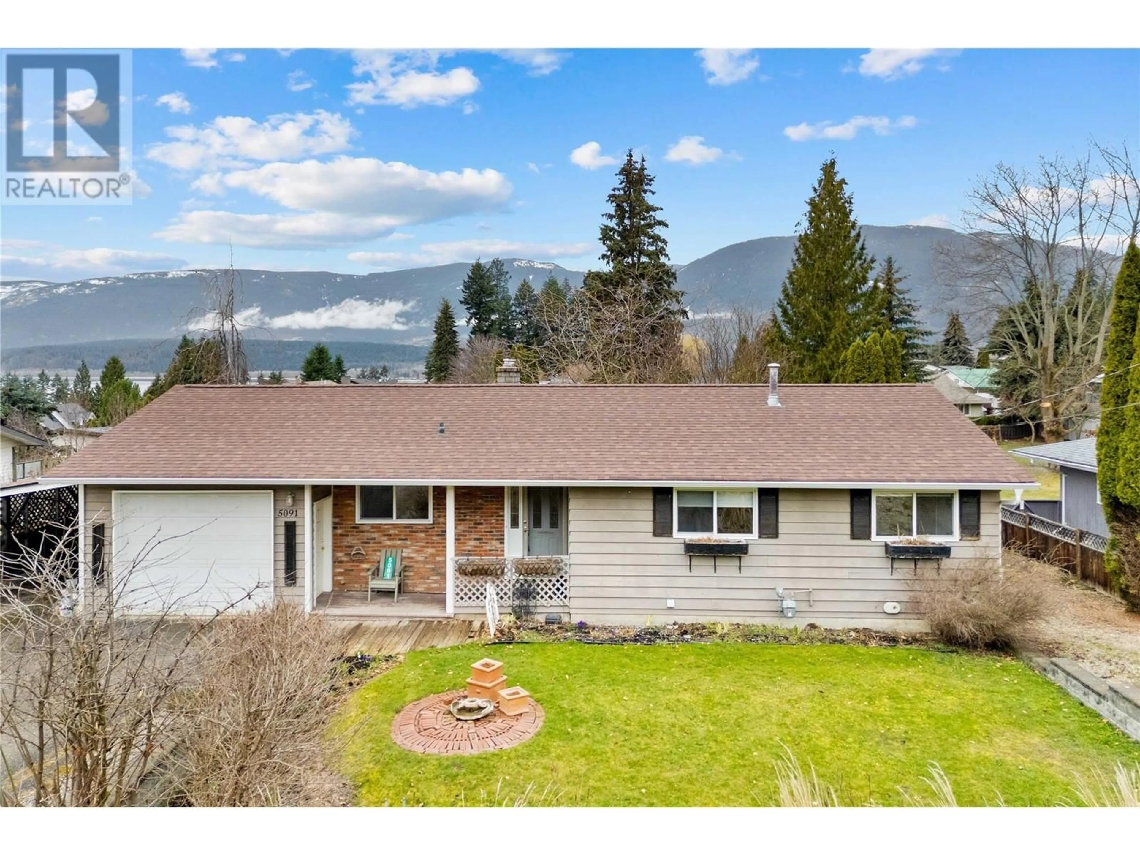 A pic from outside/outdoor area/front of a property/back of a property/a pic from drone, mountain view for 5091 LAKESHORE ROAD NORTHEAST, Salmon Arm British Columbia V1E3P4