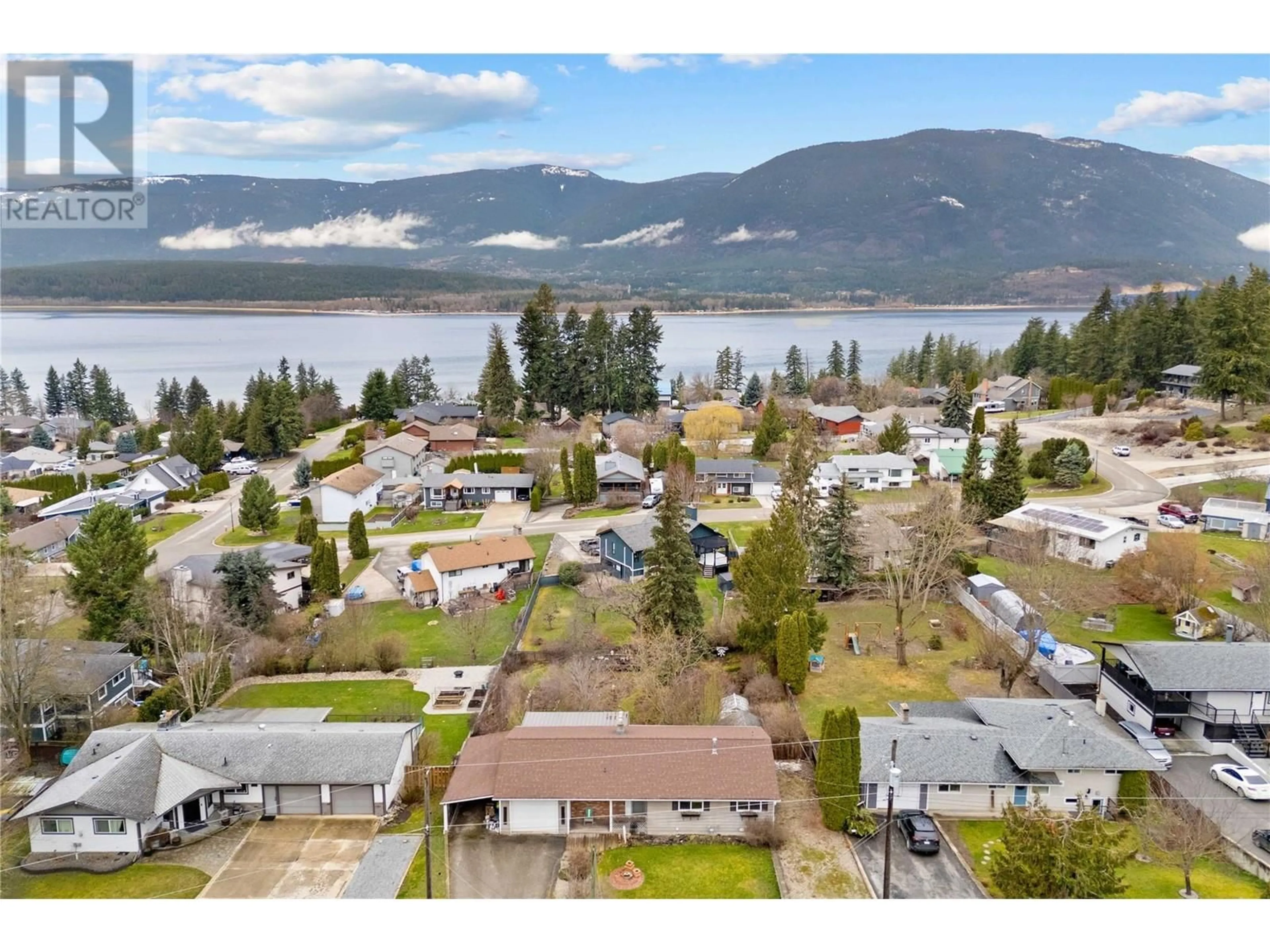A pic from outside/outdoor area/front of a property/back of a property/a pic from drone, water/lake/river/ocean view for 5091 LAKESHORE ROAD NORTHEAST, Salmon Arm British Columbia V1E3P4