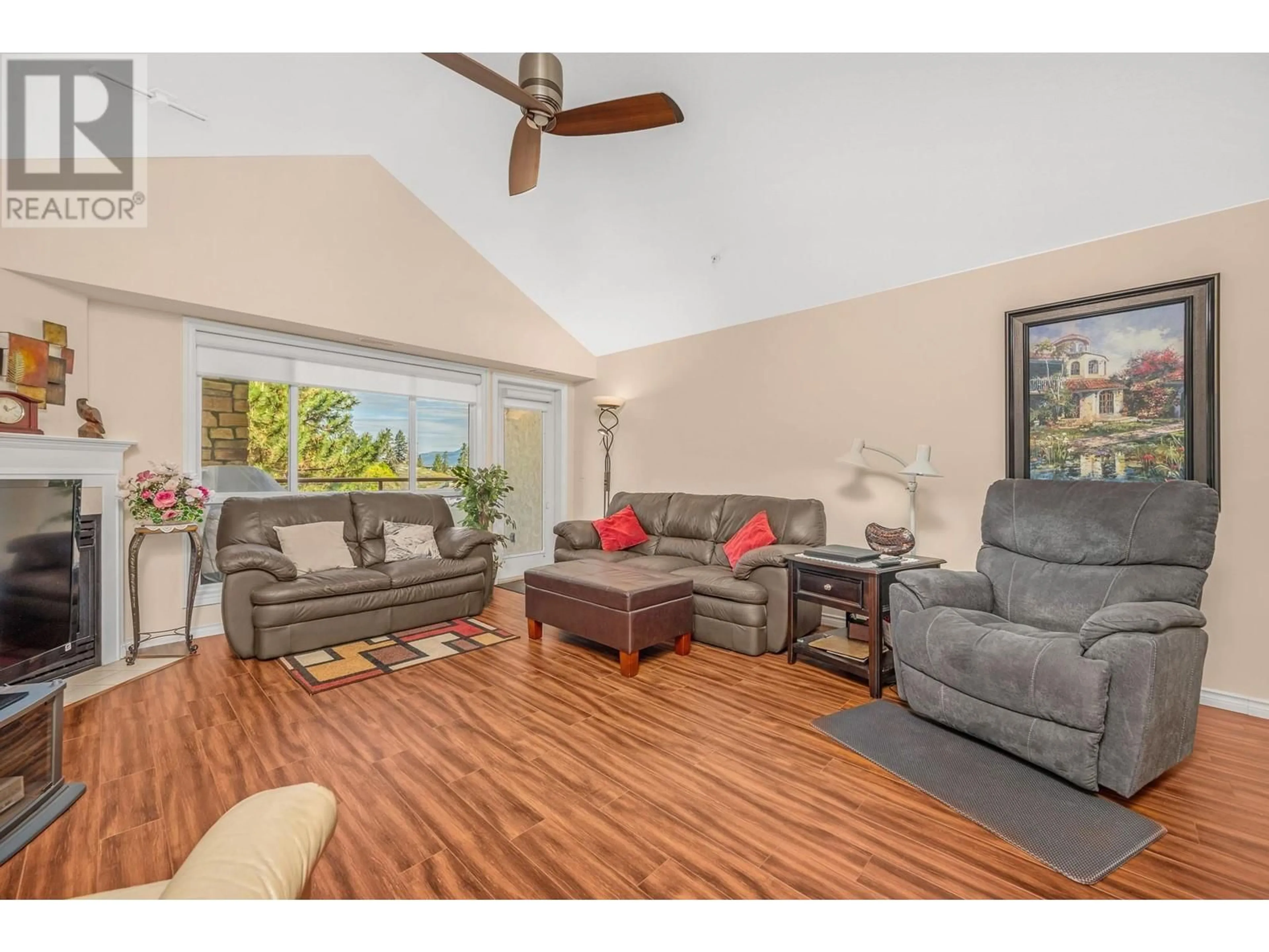 Living room with furniture, wood/laminate floor for 401 - 3301 CENTENNIAL DRIVE, Vernon British Columbia V1T2T8