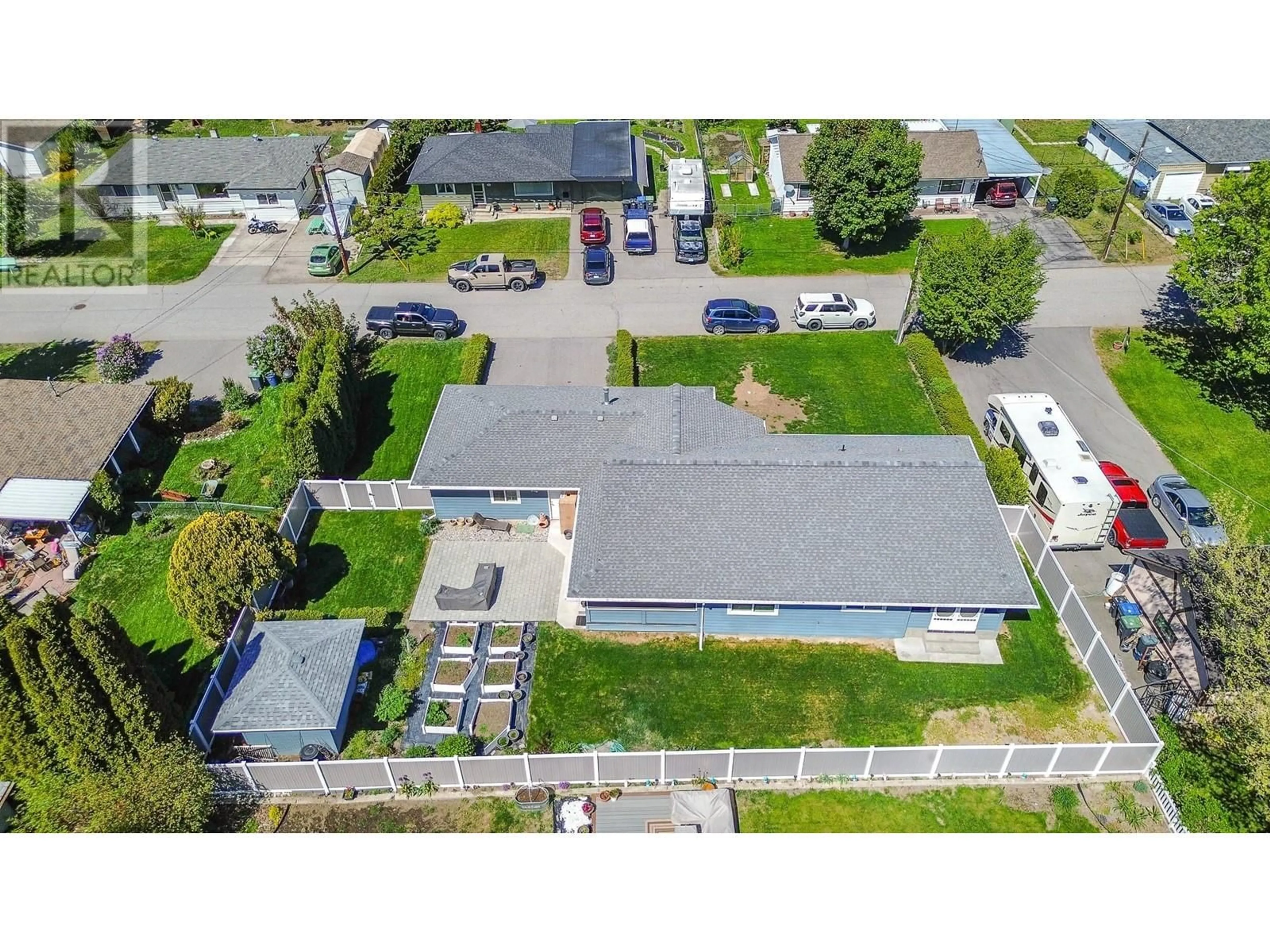 A pic from outside/outdoor area/front of a property/back of a property/a pic from drone, street for 10507 RITCHIE STREET, Summerland British Columbia V0H1Z0