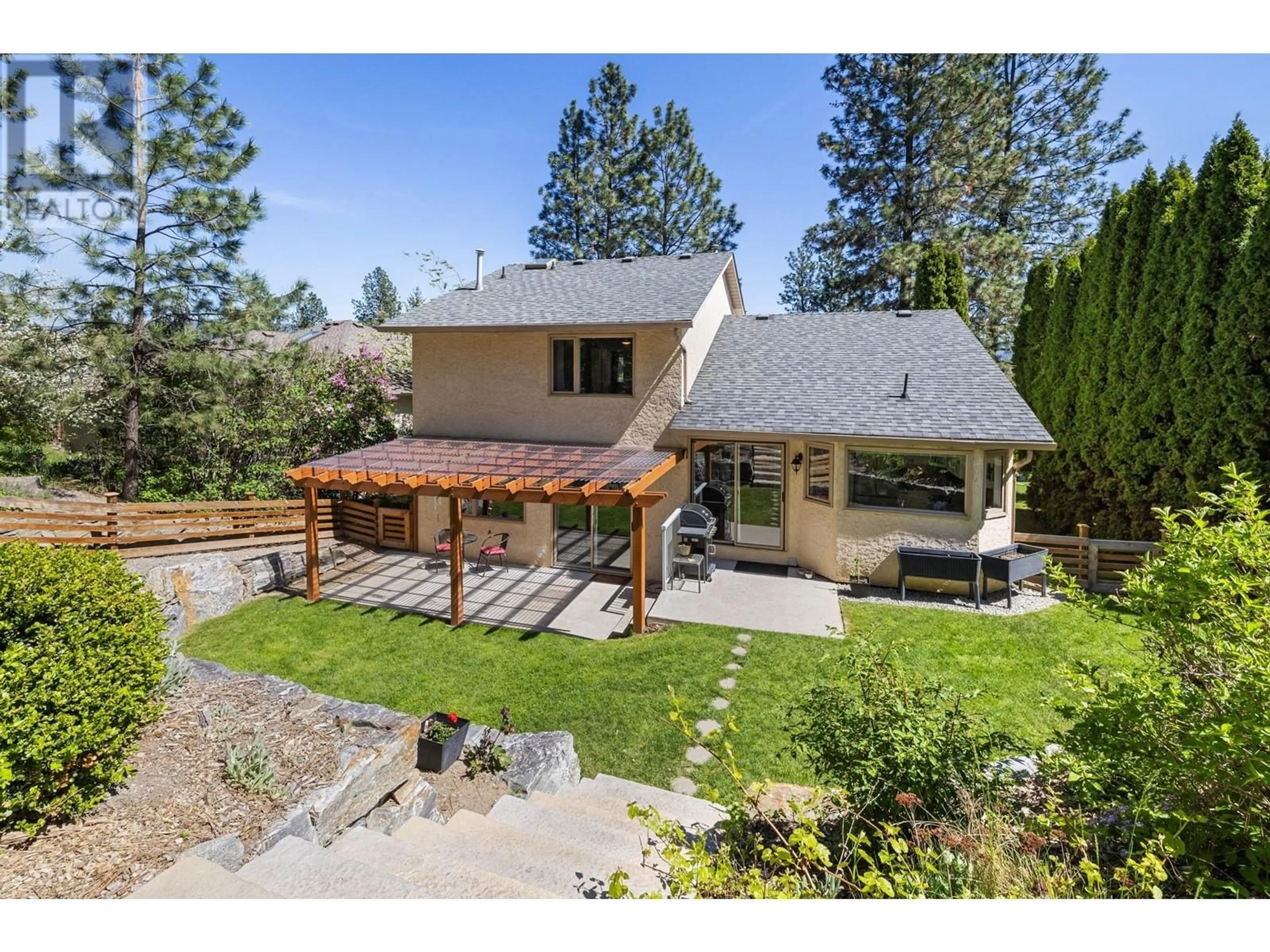 A pic from outside/outdoor area/front of a property/back of a property/a pic from drone, mountain view for 710 CASSIAR ROAD, Kelowna British Columbia V1V1M6