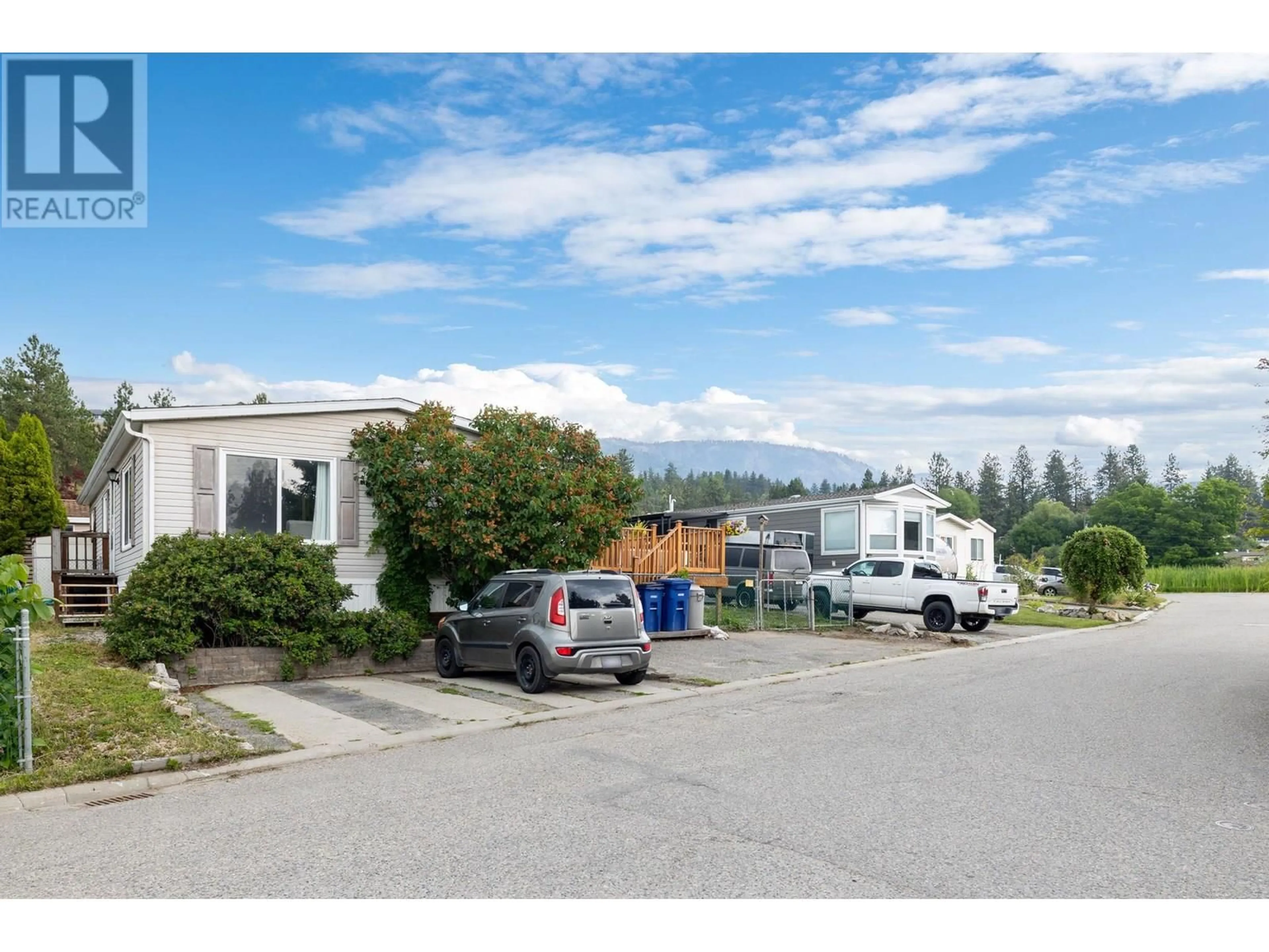 A pic from outside/outdoor area/front of a property/back of a property/a pic from drone, mountain view for 23 - 3270 SHANNON LAKE ROAD, West Kelowna British Columbia V4T2N2