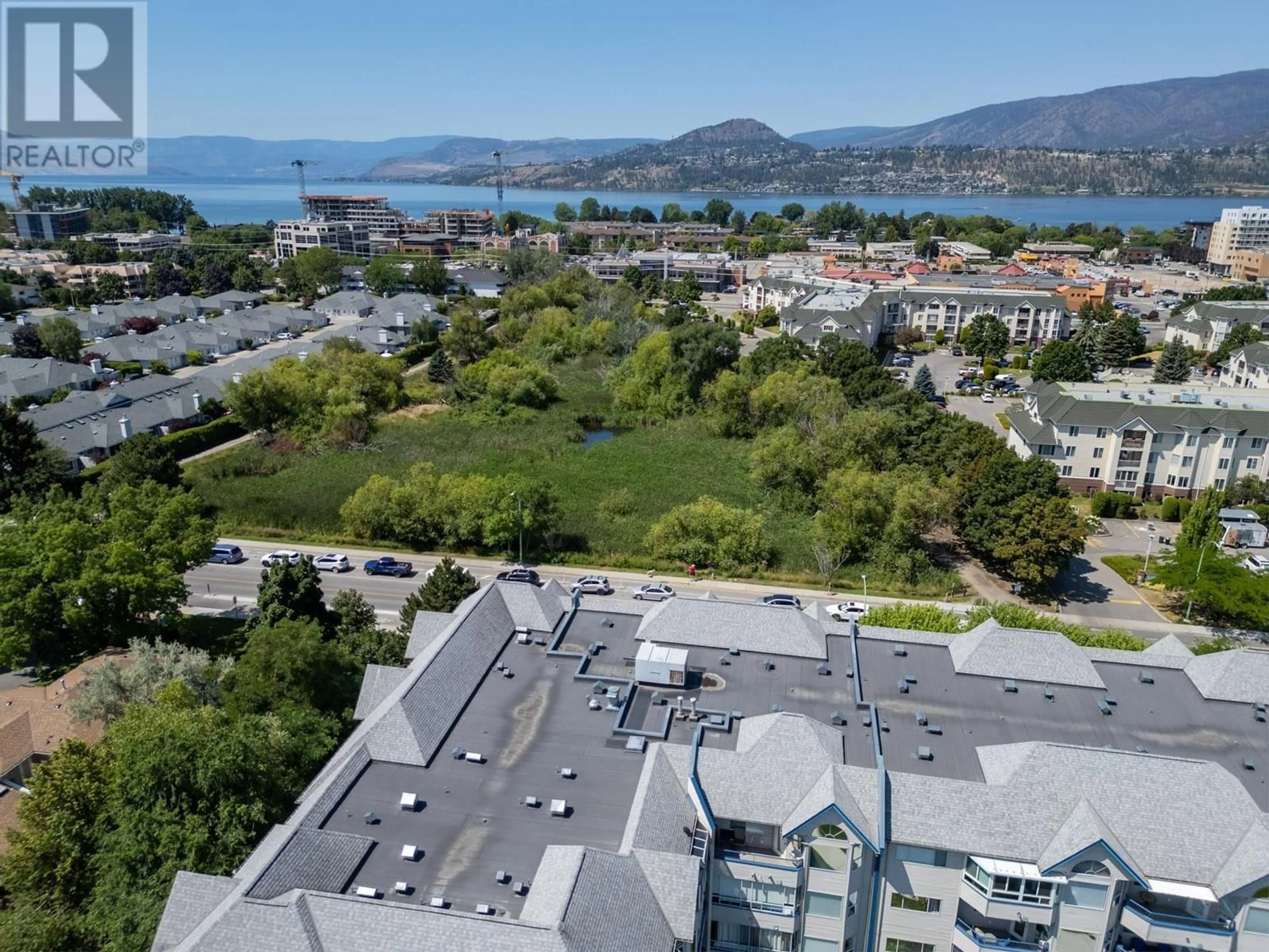 A pic from outside/outdoor area/front of a property/back of a property/a pic from drone, mountain view for 202 - 3283 CASORSO ROAD, Kelowna British Columbia V1W3L6