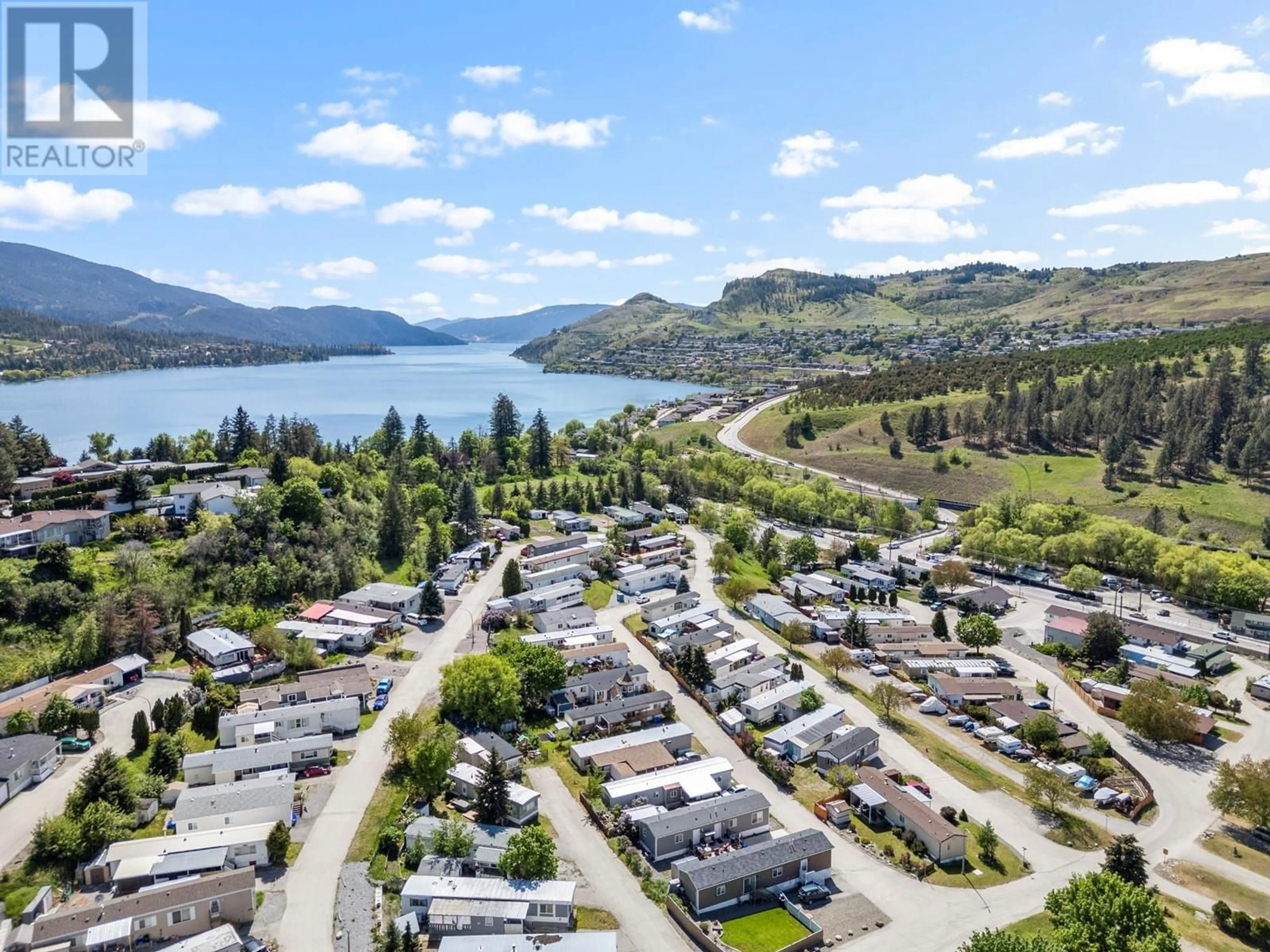 A pic from outside/outdoor area/front of a property/back of a property/a pic from drone, water/lake/river/ocean view for 210 - 15401 KALAMALKA LAKE ROAD, Coldstream British Columbia V1B1Z3