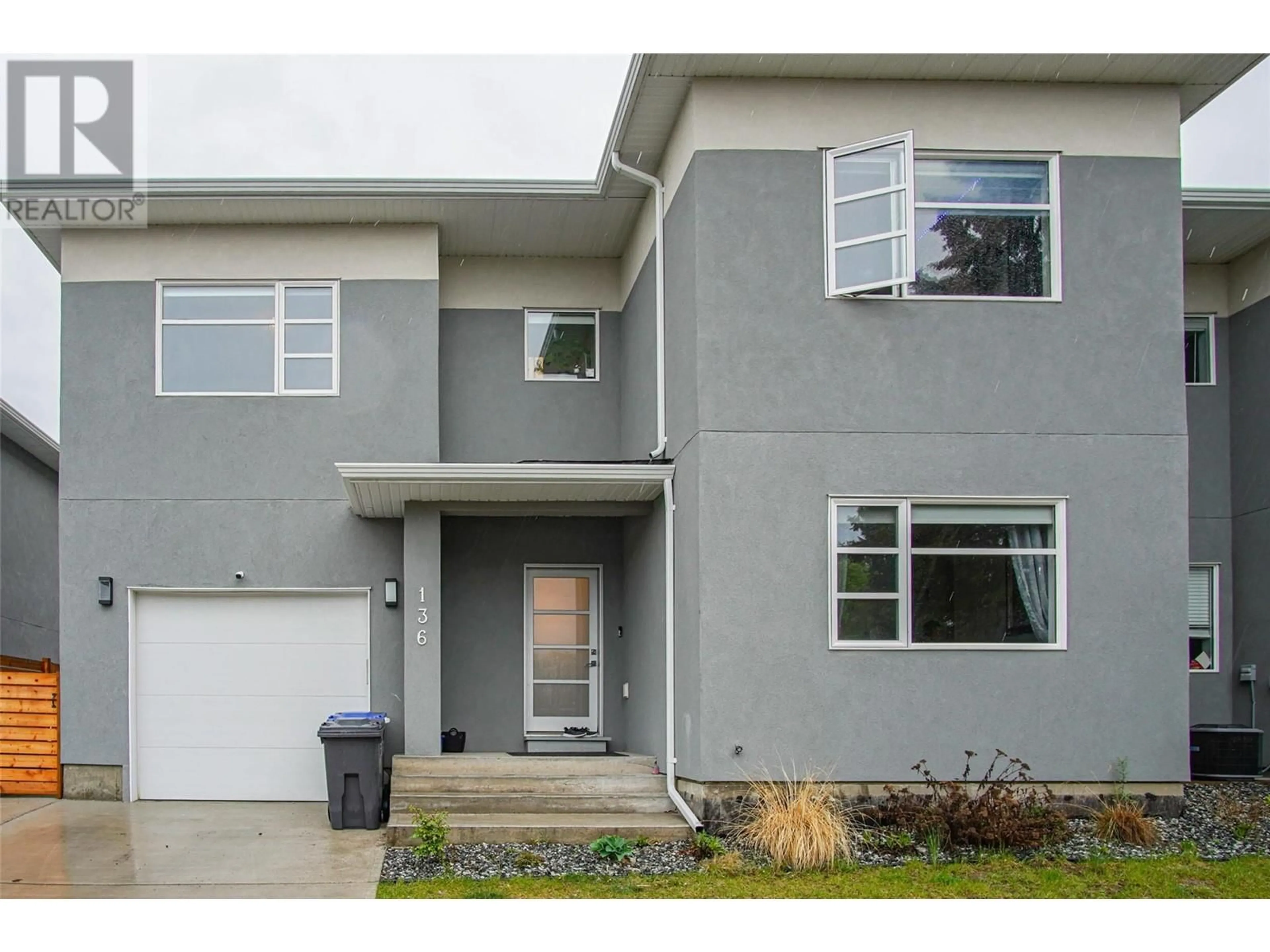 Home with vinyl exterior material, street for 136 MUGFORD ROAD, Kelowna British Columbia V1X3B3