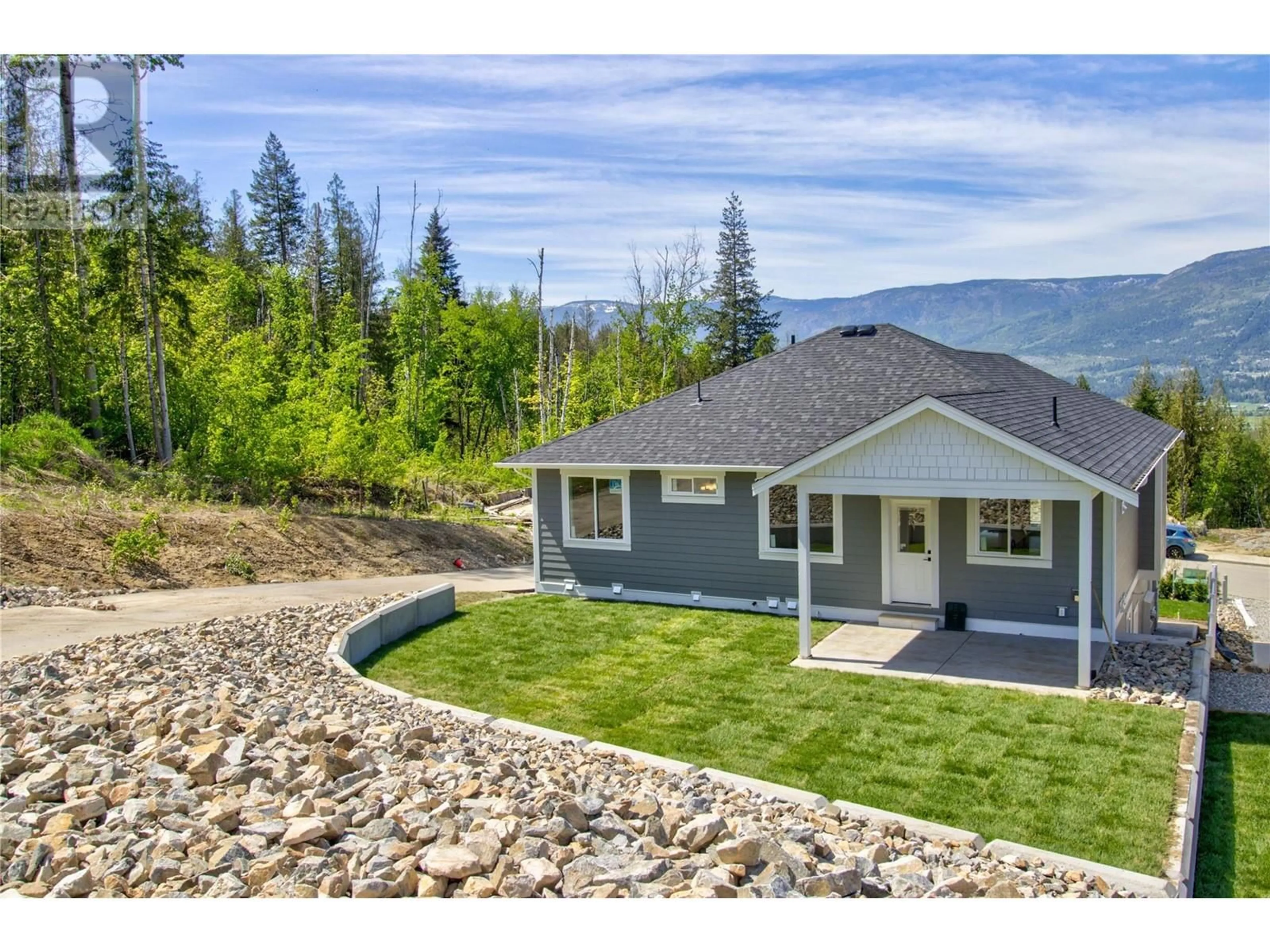 A pic from outside/outdoor area/front of a property/back of a property/a pic from drone, mountain view for 1740 9 STREET SOUTHEAST, Salmon Arm British Columbia V1E0G9