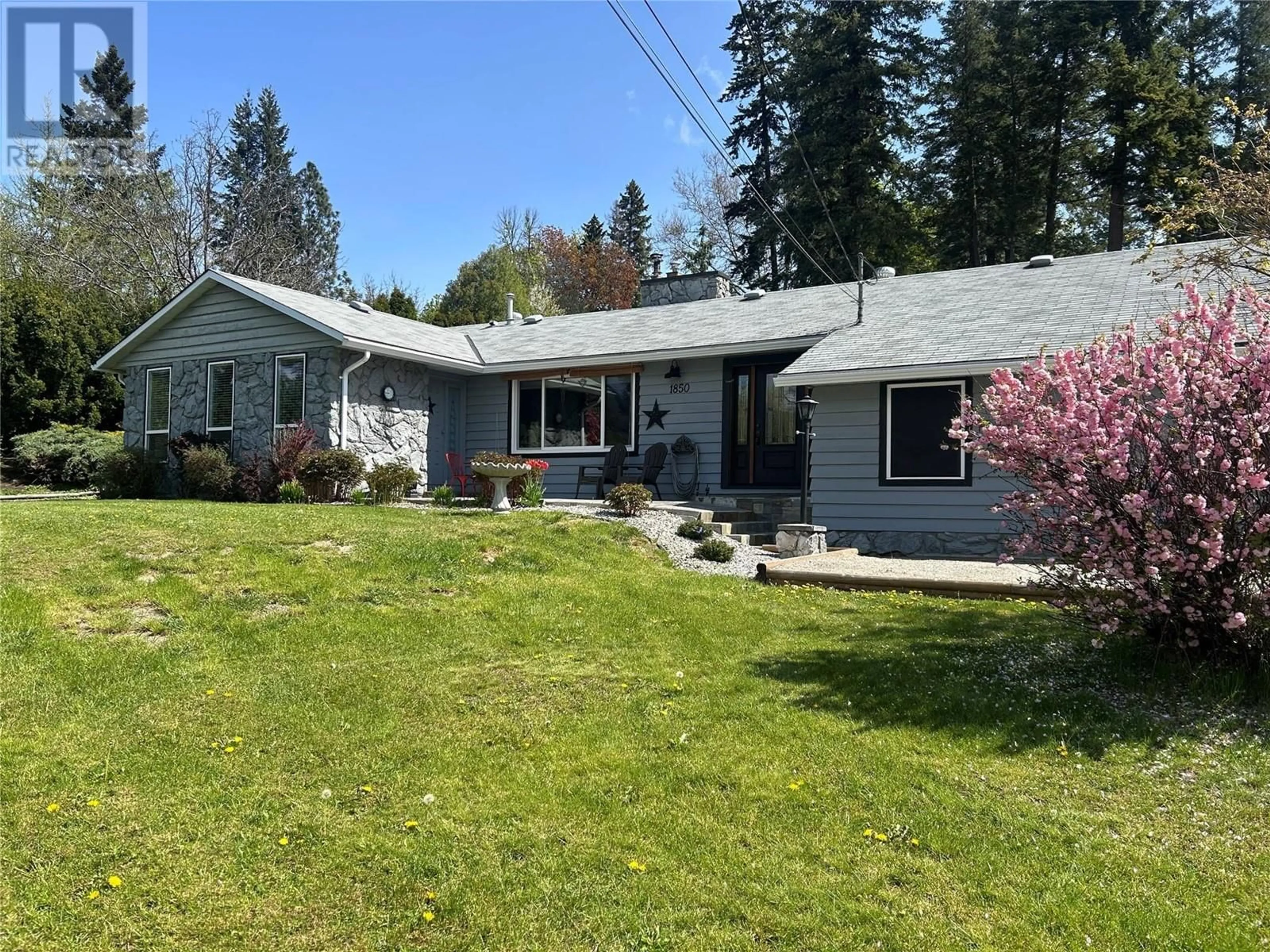 A pic from outside/outdoor area/front of a property/back of a property/a pic from drone, street for 1850 LAKESHORE ROAD, Salmon Arm British Columbia V1E3X7