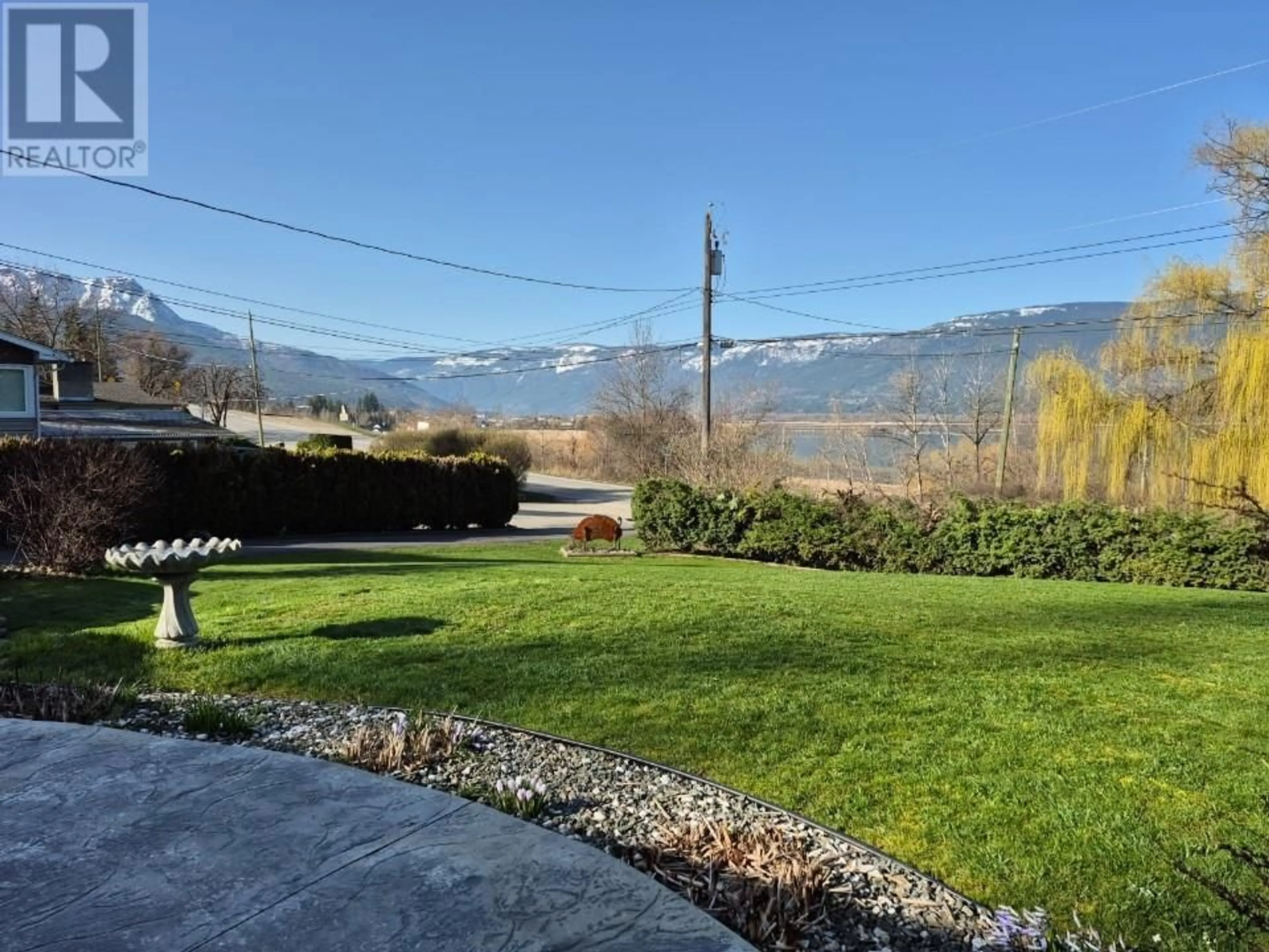 A pic from outside/outdoor area/front of a property/back of a property/a pic from drone, mountain view for 1850 LAKESHORE ROAD, Salmon Arm British Columbia V1E3X7