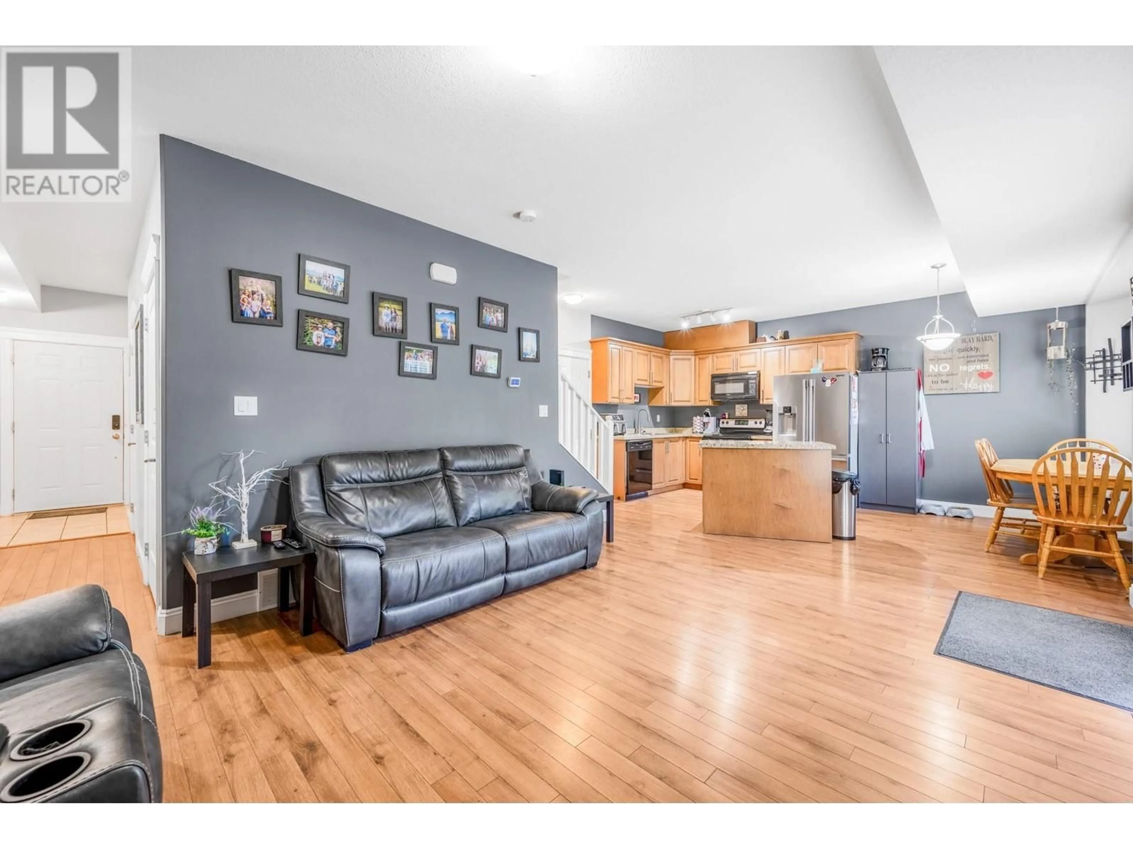 Open concept kitchen, wood/laminate floor for 102 - 1096 FAIRVIEW ROAD, Penticton British Columbia V2A5Z2