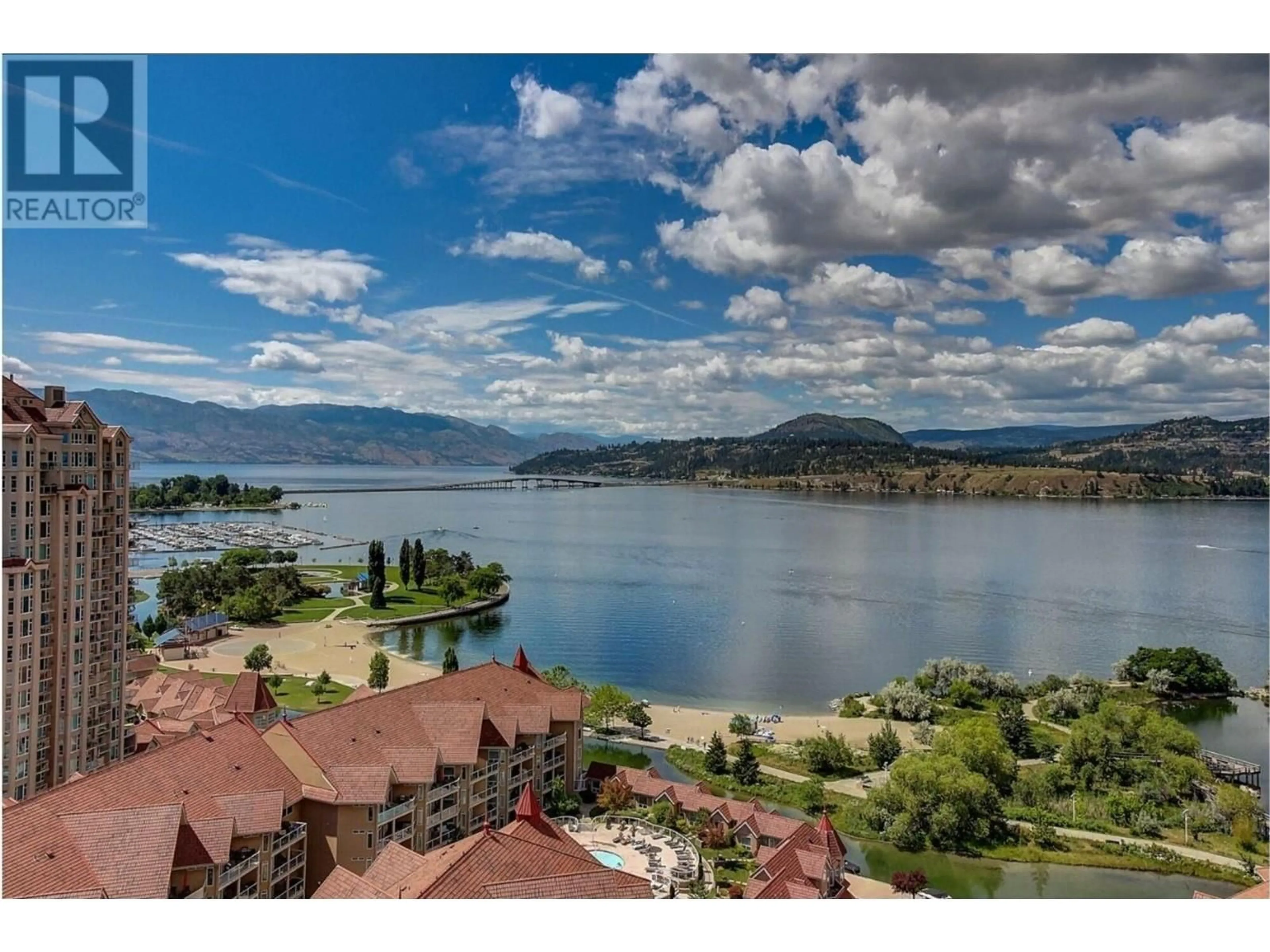 A pic from outside/outdoor area/front of a property/back of a property/a pic from drone, water/lake/river/ocean view for 2207 - 1075 SUNSET DRIVE, Kelowna British Columbia V1Y9Y9