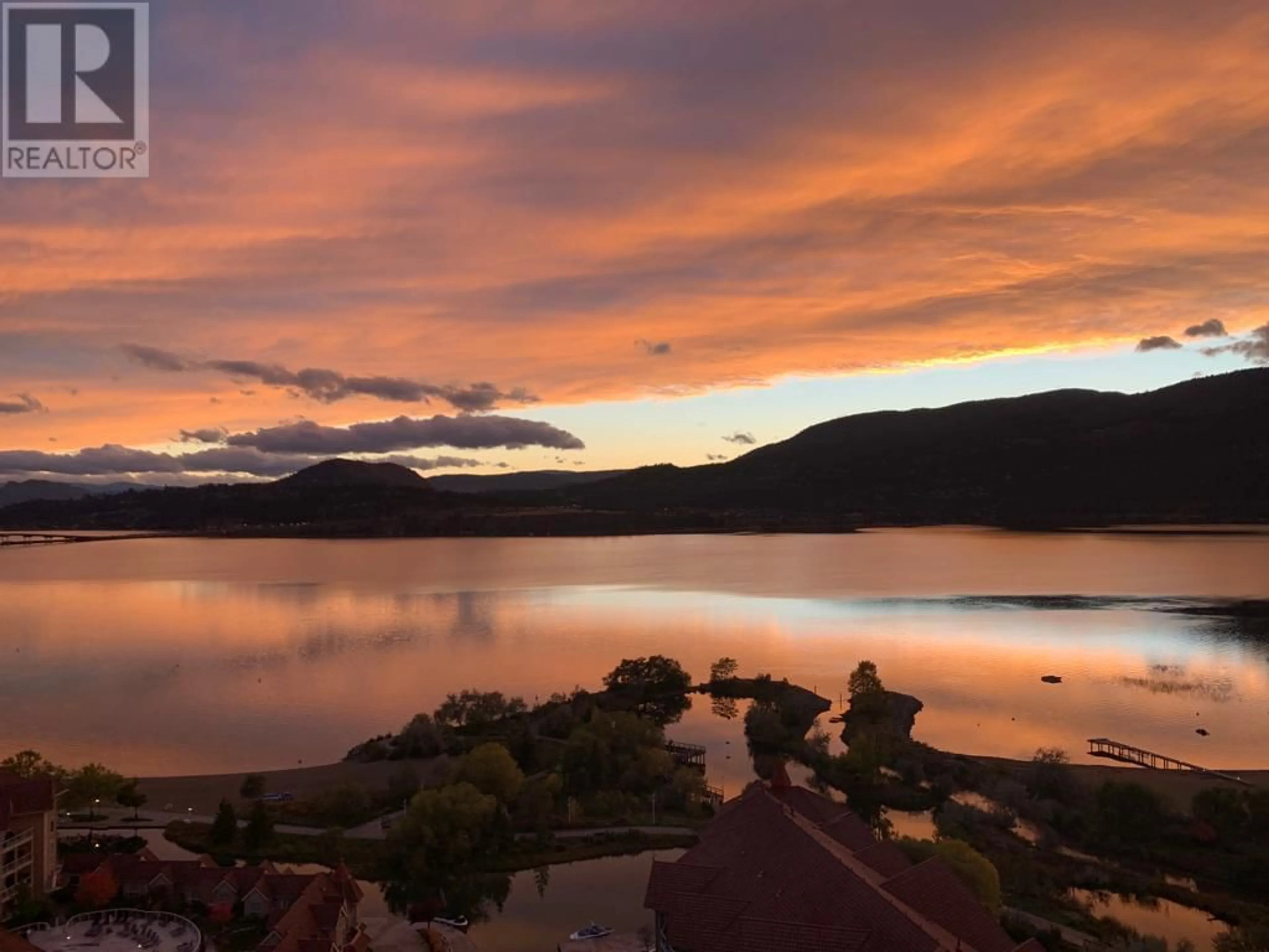 A pic from outside/outdoor area/front of a property/back of a property/a pic from drone, water/lake/river/ocean view for 2207 - 1075 SUNSET DRIVE, Kelowna British Columbia V1Y9Y9