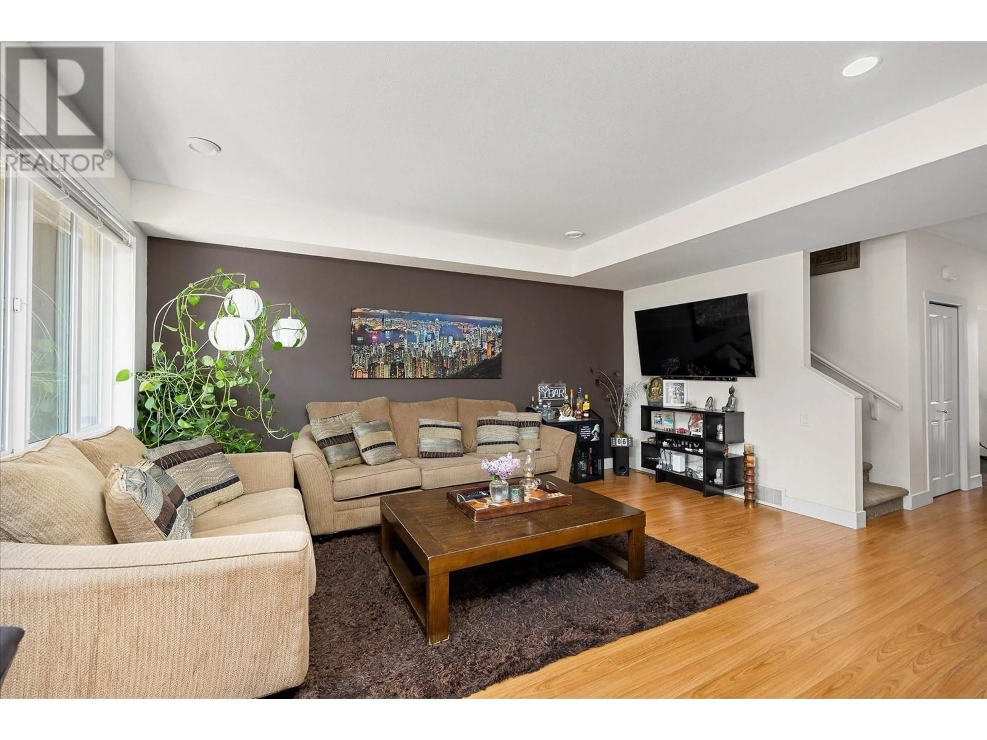 Living room with furniture, wood/laminate floor for 4 - 9626 JENSEN ROAD, Lake Country British Columbia V4V1S6