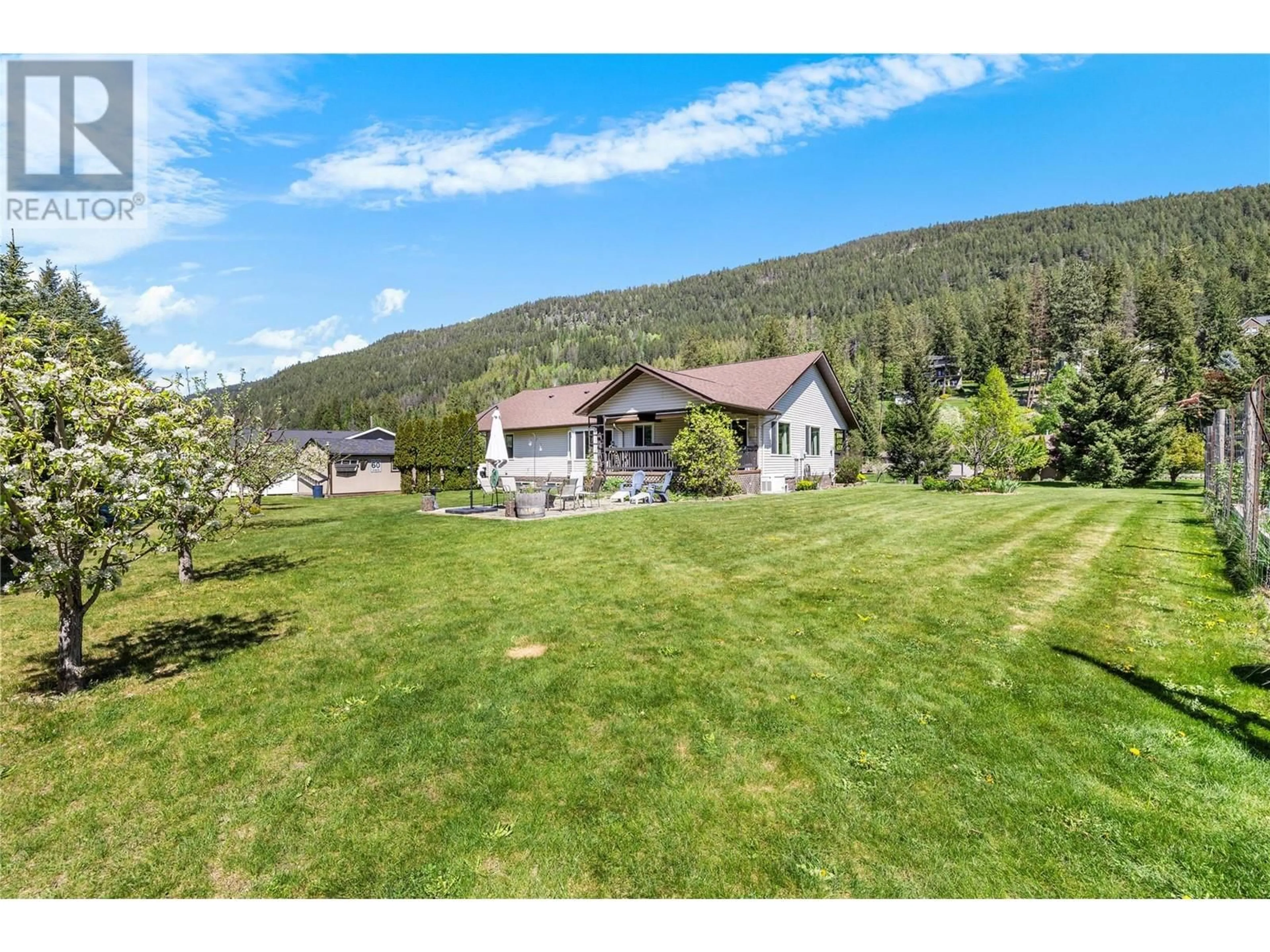 A pic from outside/outdoor area/front of a property/back of a property/a pic from drone, mountain view for 1333 8TH AVENUE NORTH, Creston British Columbia V0B1G6