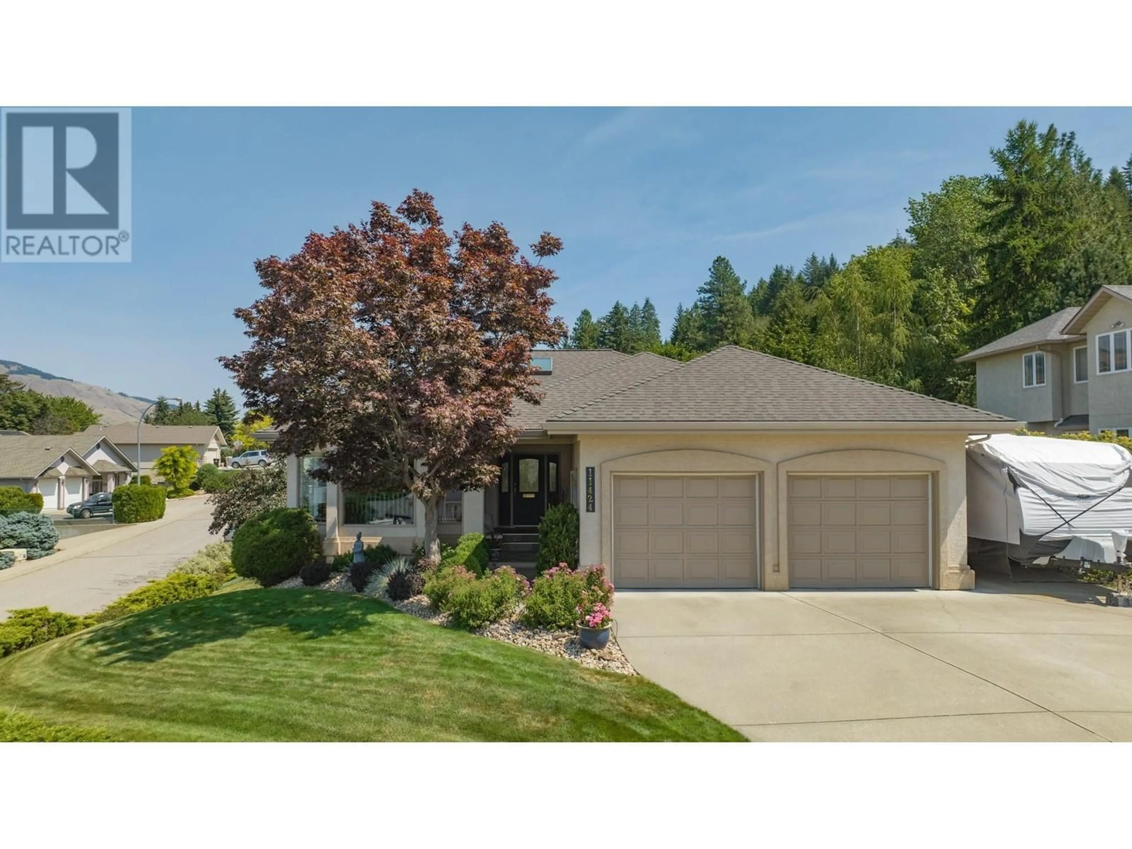 Home with vinyl exterior material, street for 11424 PALFREY DRIVE EAST OTHER, Coldstream British Columbia V1B2B1