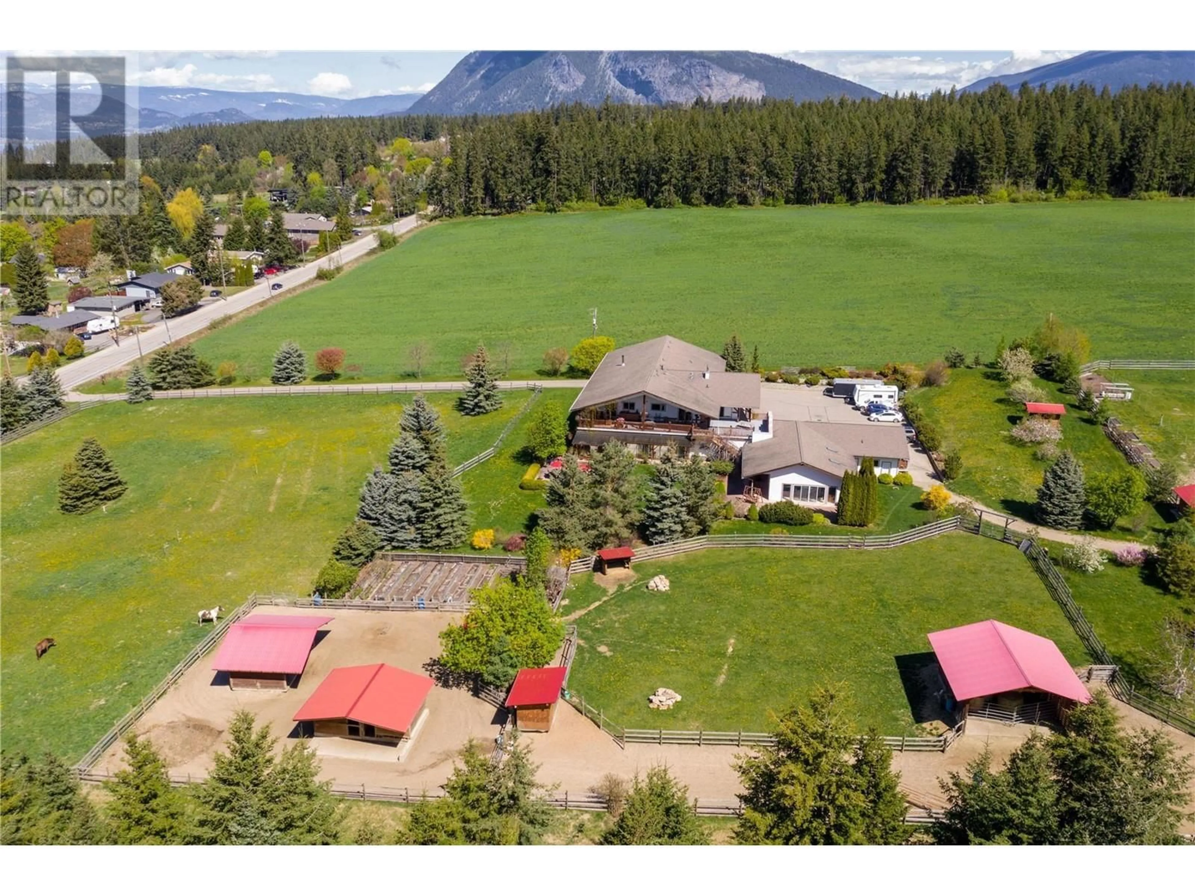 A pic from outside/outdoor area/front of a property/back of a property/a pic from drone, mountain view for 2190 30 STREET NORTHEAST, Salmon Arm British Columbia V1E3G9