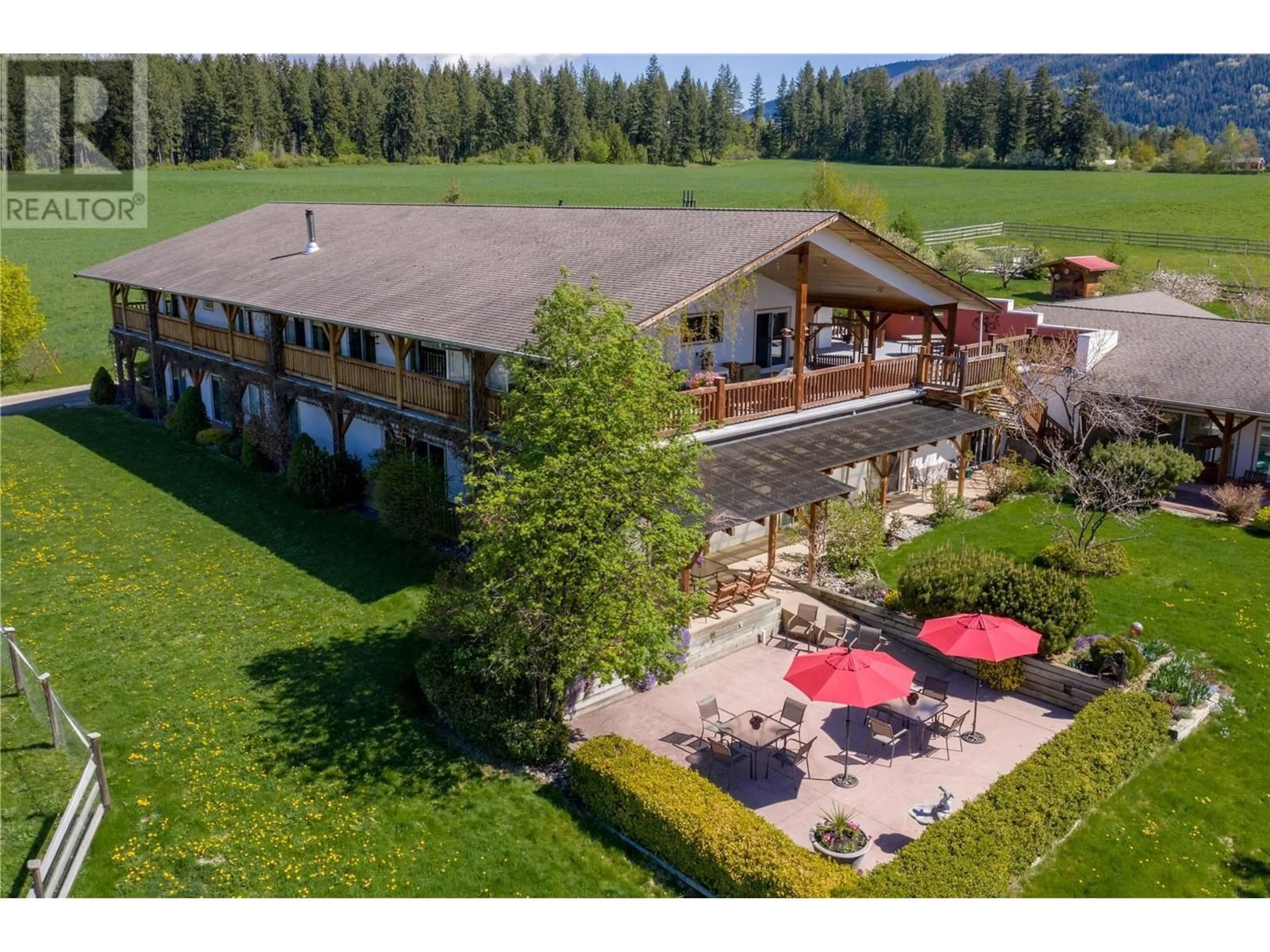 A pic from outside/outdoor area/front of a property/back of a property/a pic from drone, mountain view for 2190 30 STREET NORTHEAST, Salmon Arm British Columbia V1E3G9