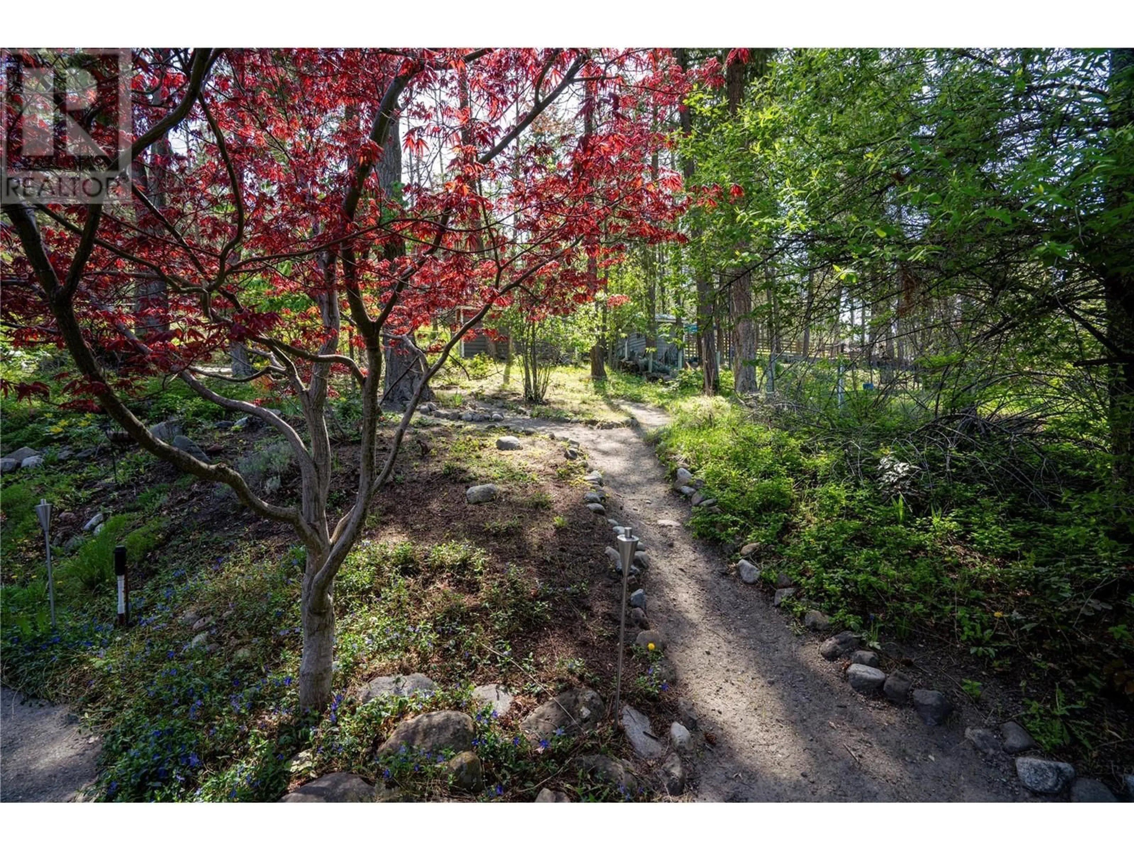 A pic from outside/outdoor area/front of a property/back of a property/a pic from drone, forest/trees view for 945 LLOYD JONES DRIVE, West Kelowna British Columbia V1Z2X9
