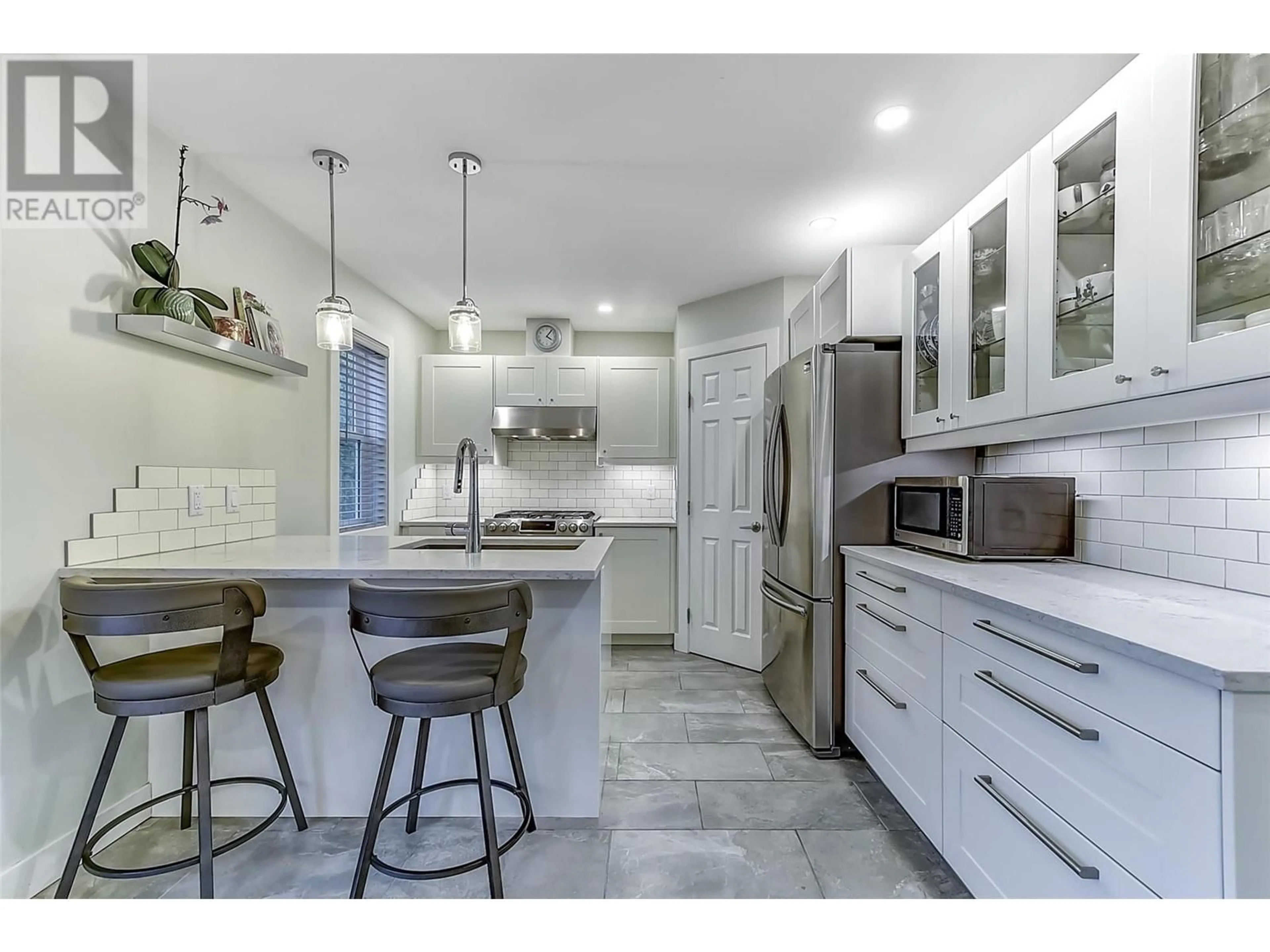 Open concept kitchen, ceramic/tile floor for 2202 ABERDEEN STREET, Kelowna British Columbia V1Y2T4