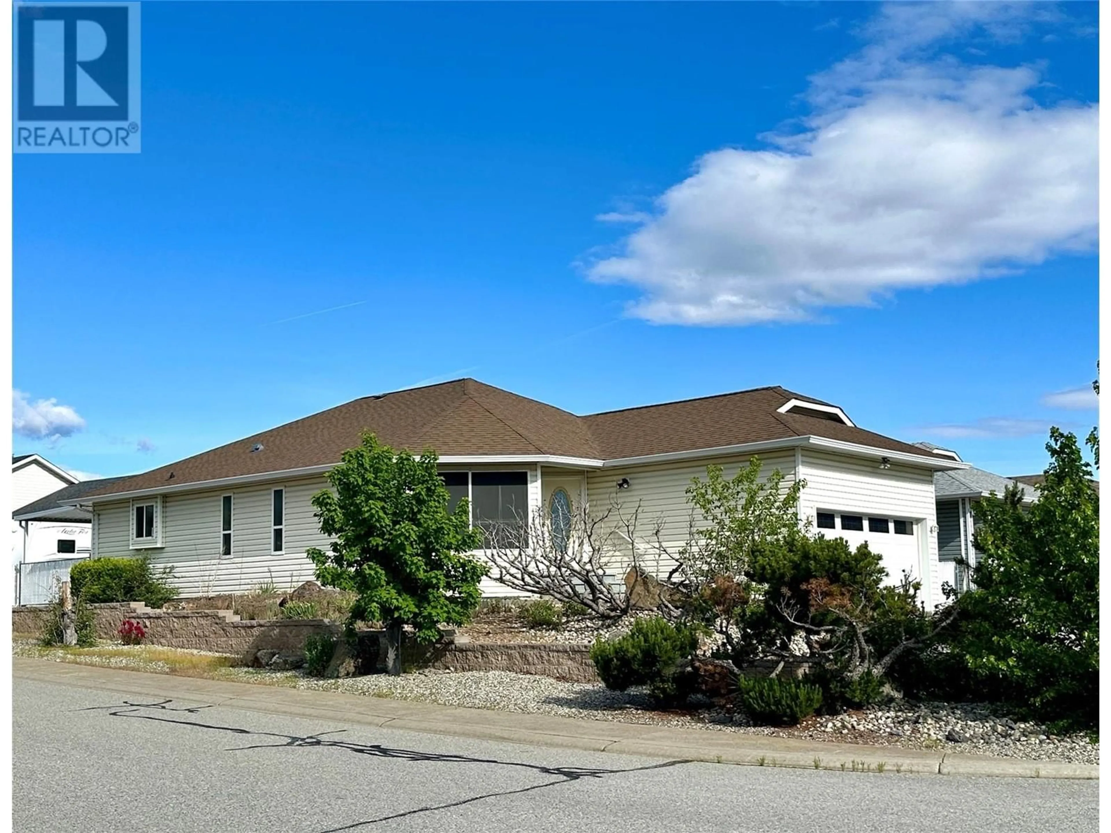 Home with vinyl exterior material, street for 16 KILLDEER PLACE, Osoyoos British Columbia V0H1V5