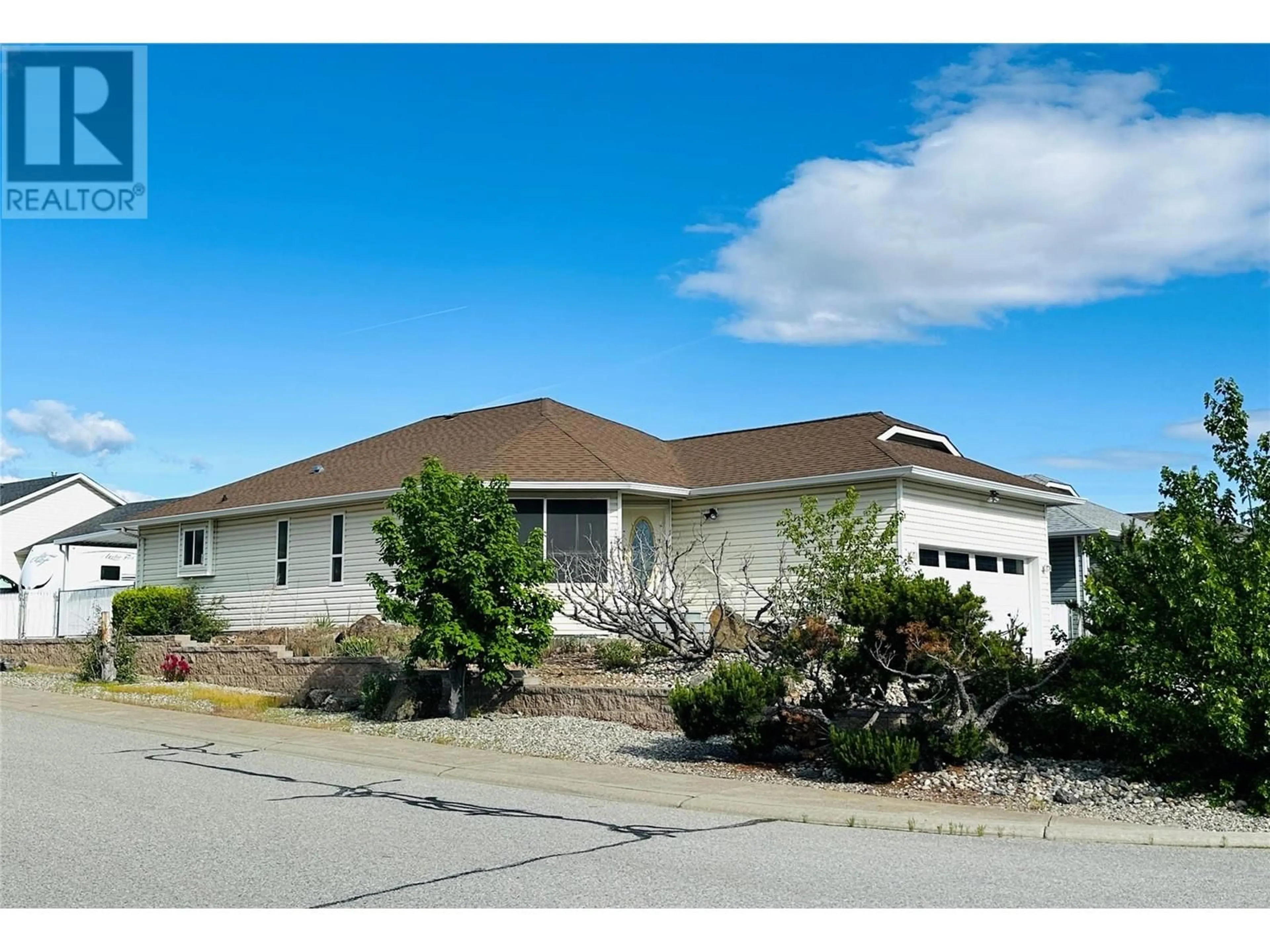 Home with vinyl exterior material, street for 16 KILLDEER PLACE, Osoyoos British Columbia V0H1V5
