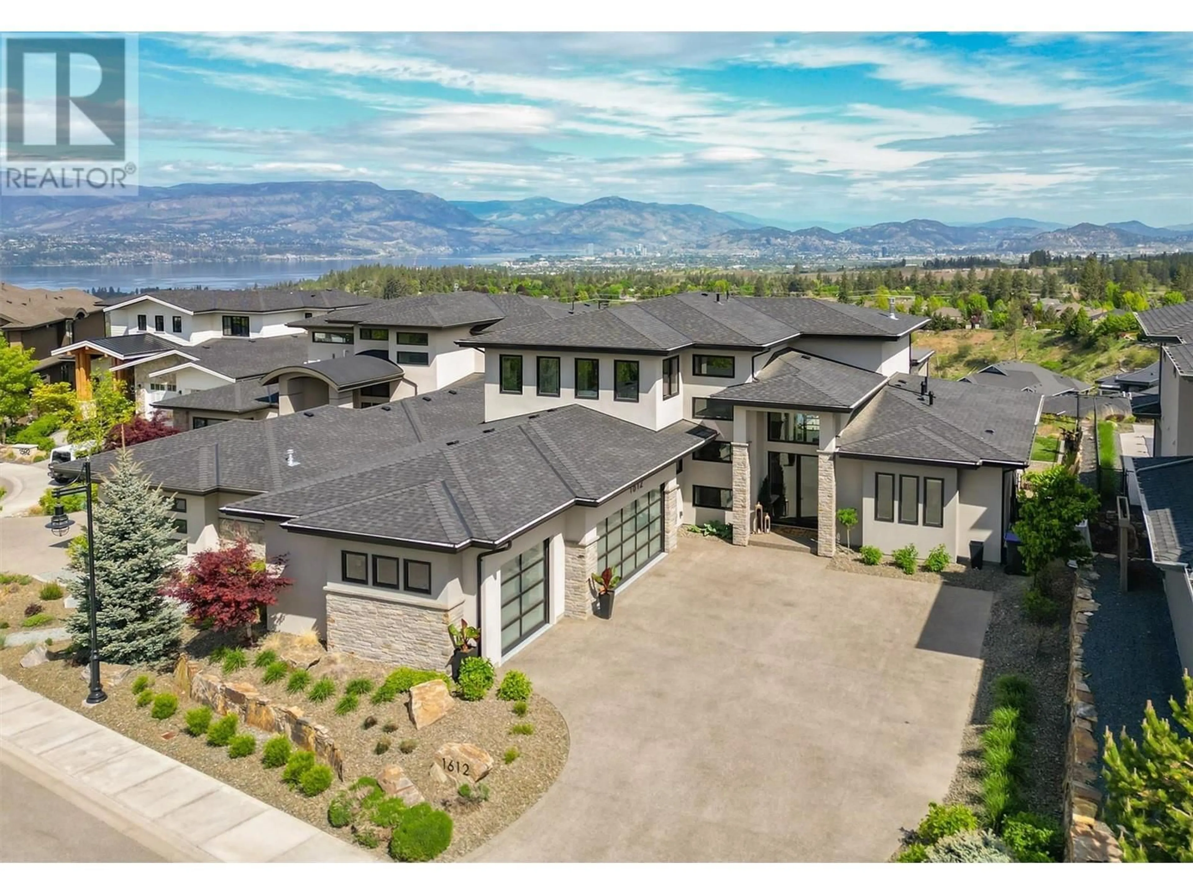 A pic from outside/outdoor area/front of a property/back of a property/a pic from drone, mountain view for 1612 VINCENT PLACE, Kelowna British Columbia V1W5N9