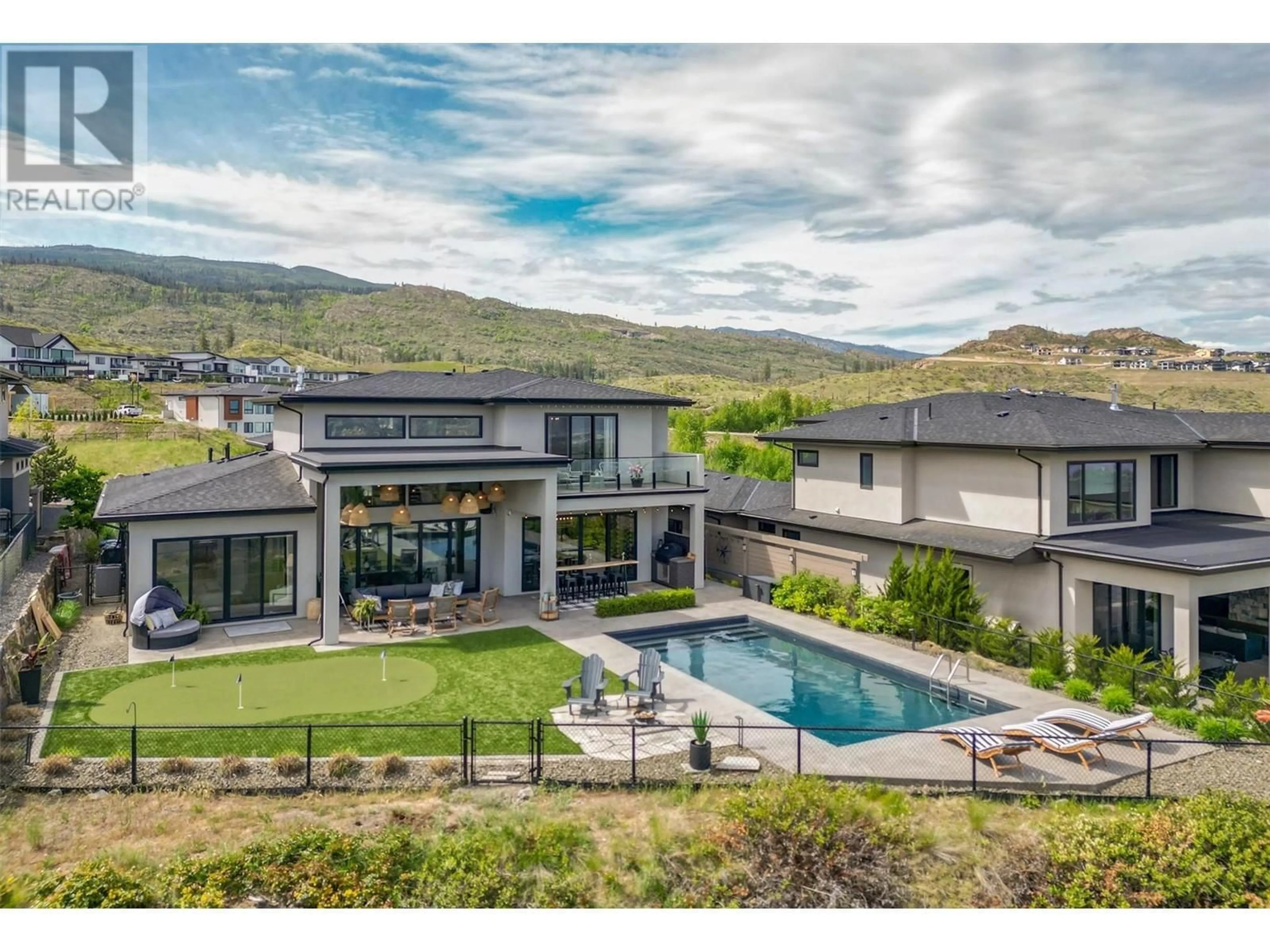 A pic from outside/outdoor area/front of a property/back of a property/a pic from drone, mountain view for 1612 VINCENT PLACE, Kelowna British Columbia V1W5N9