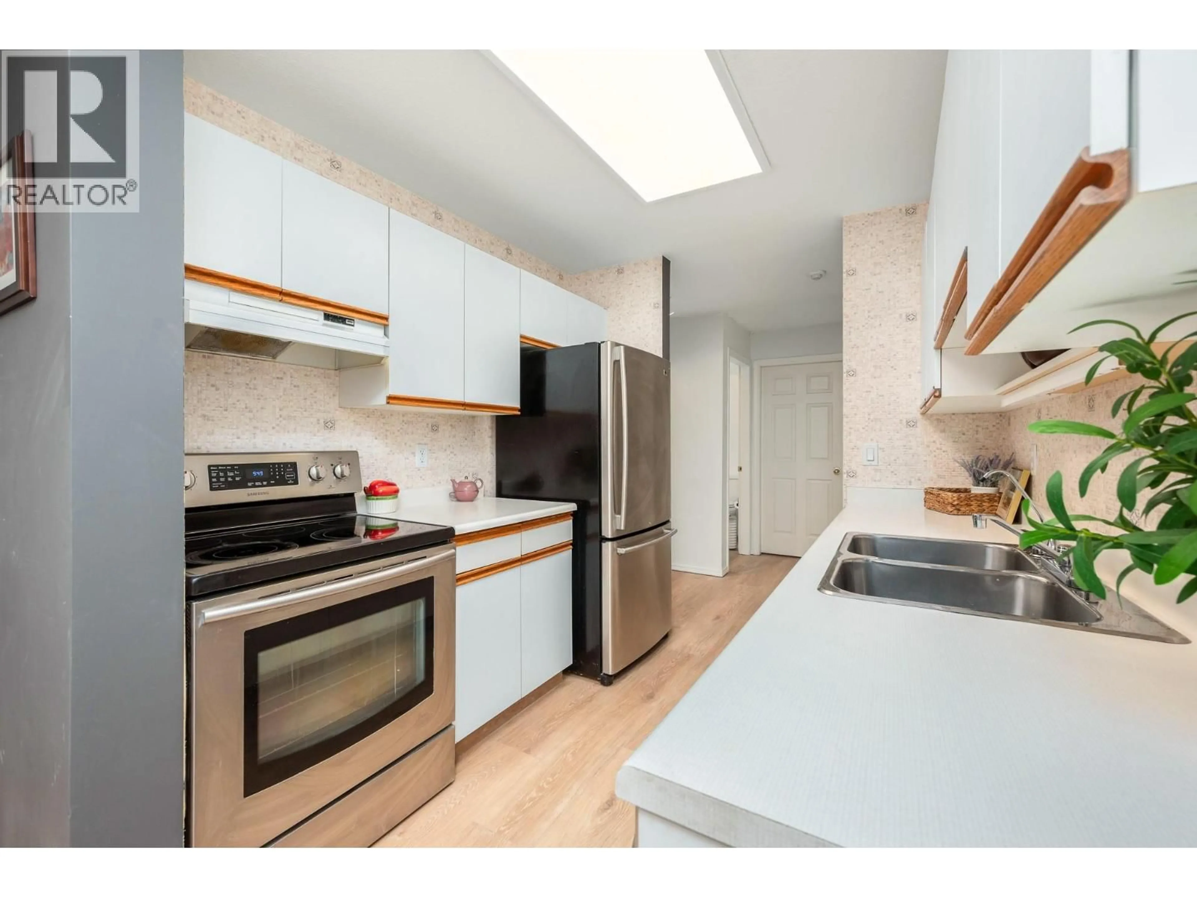 Standard kitchen, wood/laminate floor for 209 - 3609 30 AVENUE, Vernon British Columbia V1T2E6