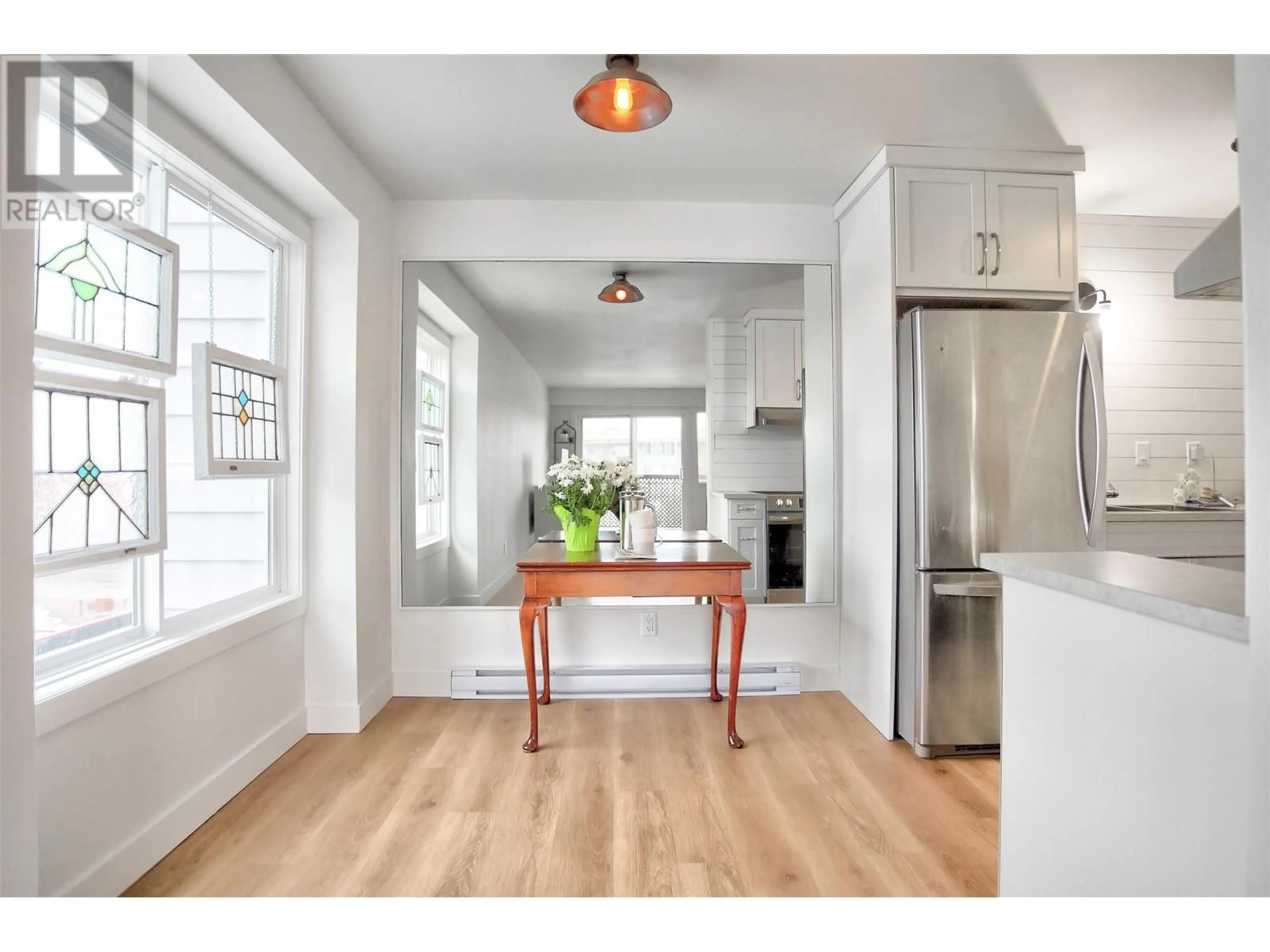 Open concept kitchen, wood/laminate floor for 202 - 95 WINNIPEG STREET, Penticton British Columbia V2A5L9