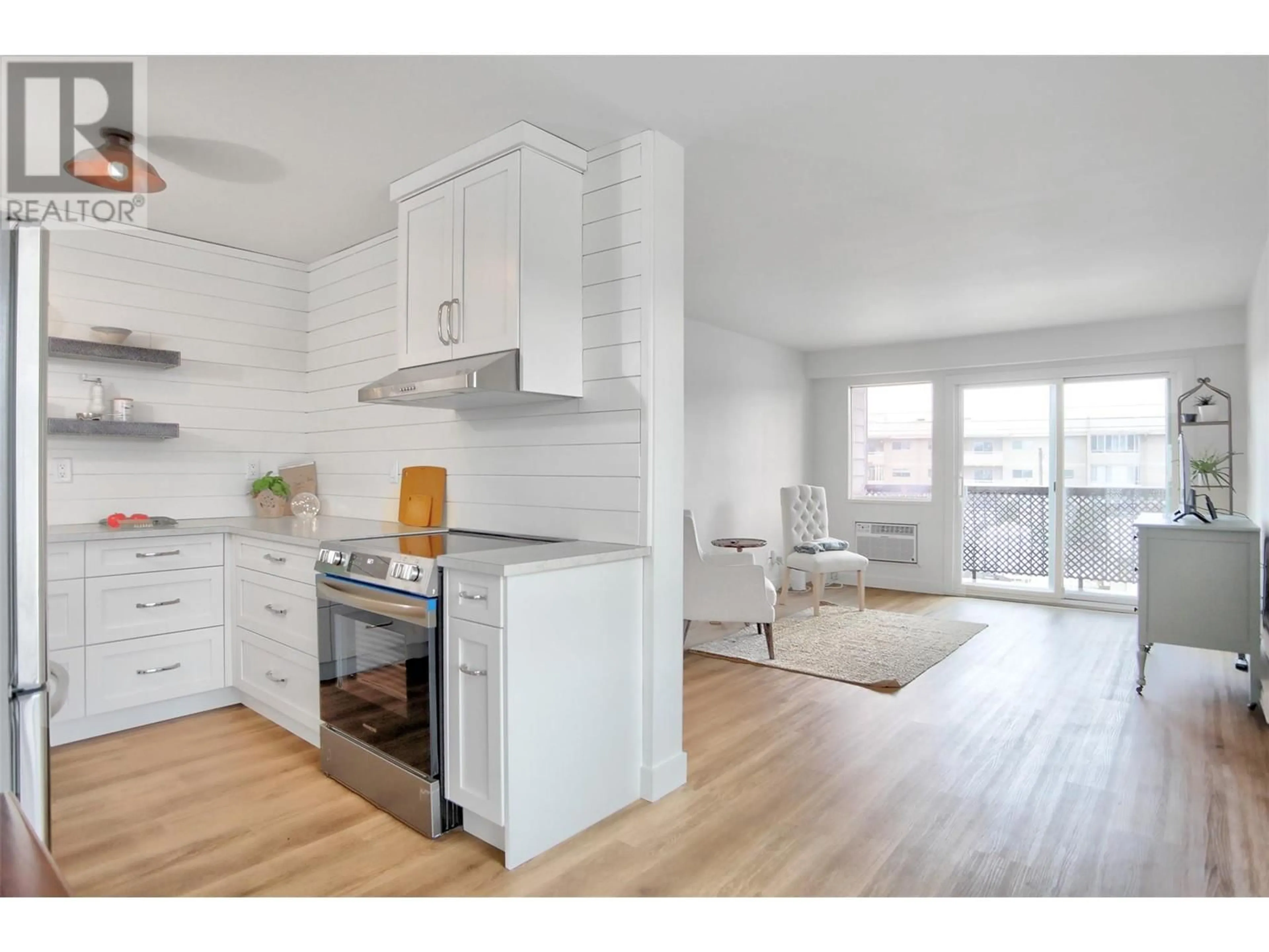 Open concept kitchen, wood/laminate floor for 202 - 95 WINNIPEG STREET, Penticton British Columbia V2A5L9
