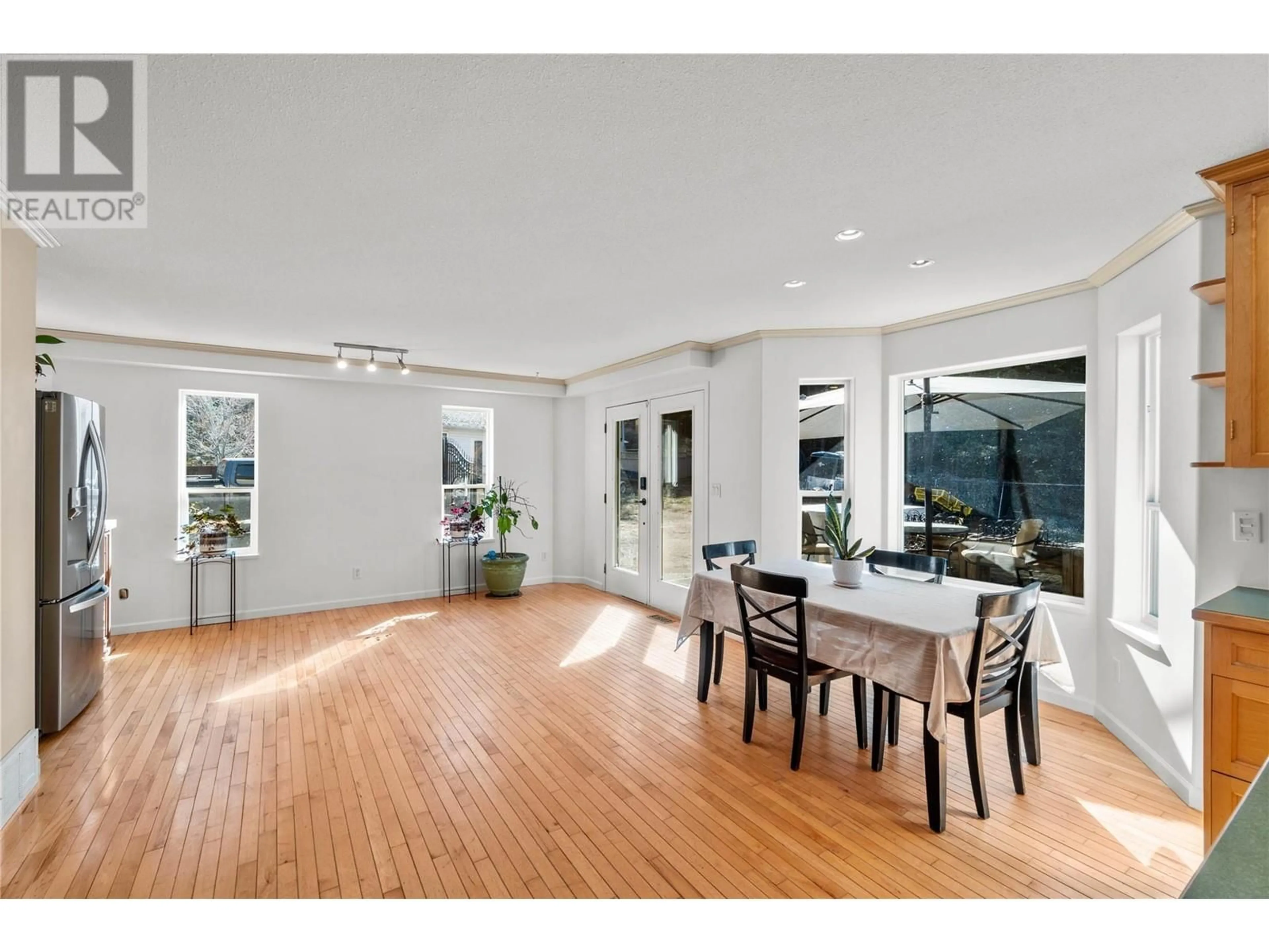 Dining room, wood/laminate floor for 4942 WOODLAND COURT, Kamloops British Columbia V2C6V5
