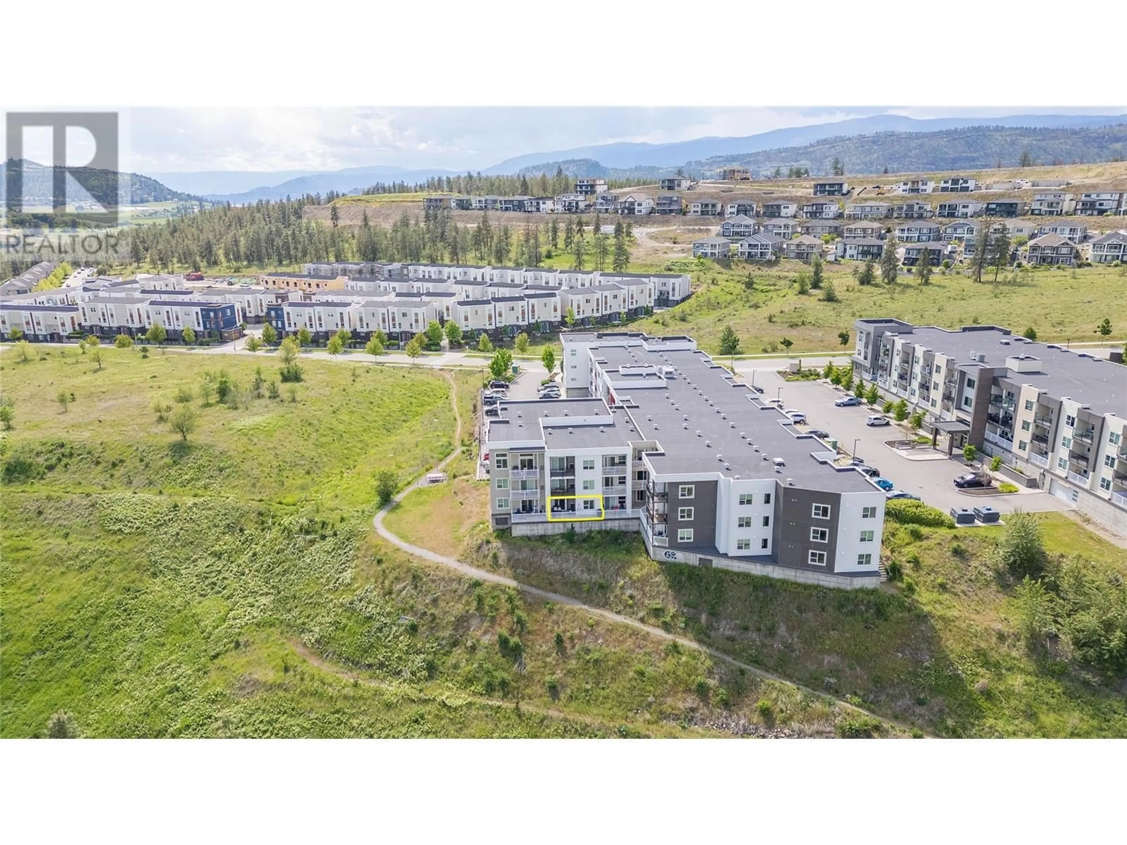A pic from outside/outdoor area/front of a property/back of a property/a pic from drone, mountain view for 130 - 625 ACADEMY WAY, Kelowna British Columbia V1V0E3