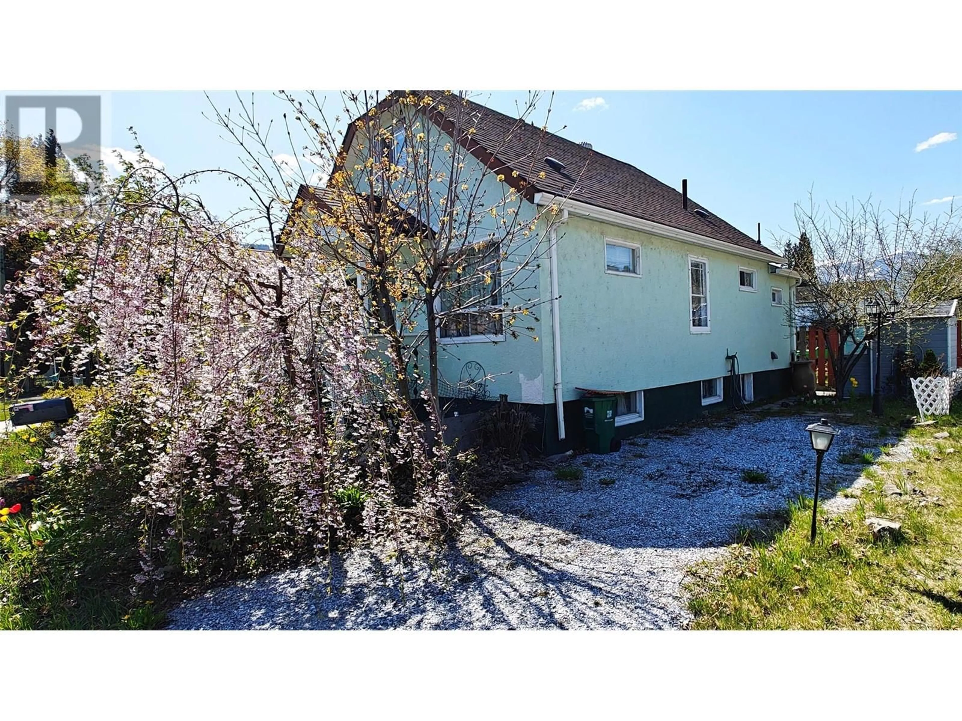 A pic from outside/outdoor area/front of a property/back of a property/a pic from drone, street for 1889 BOWSER STREET, Trail British Columbia V1R2Z5