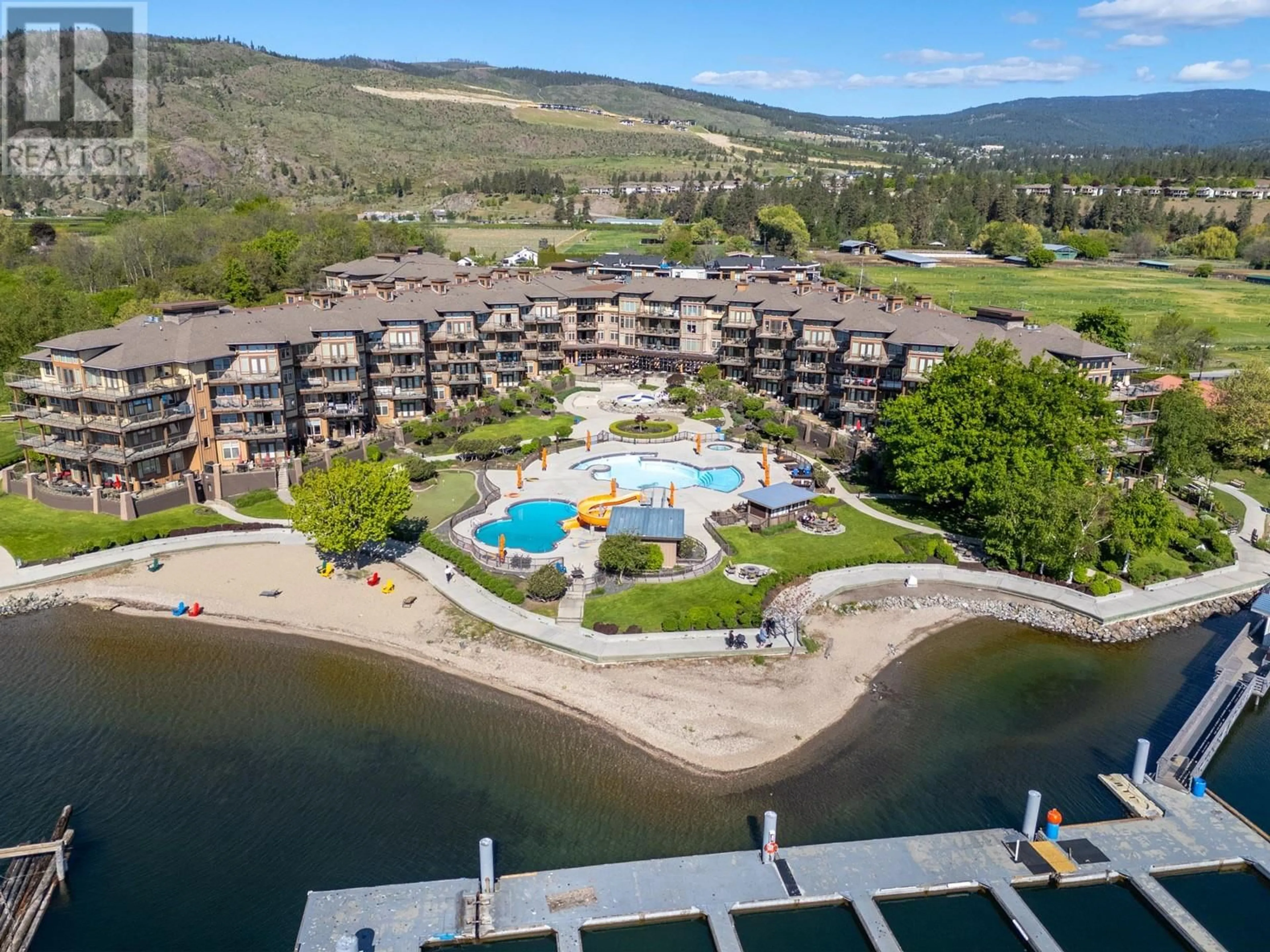 A pic from outside/outdoor area/front of a property/back of a property/a pic from drone, water/lake/river/ocean view for 107 - 4205 GELLATLY ROAD, West Kelowna British Columbia V4T2K2