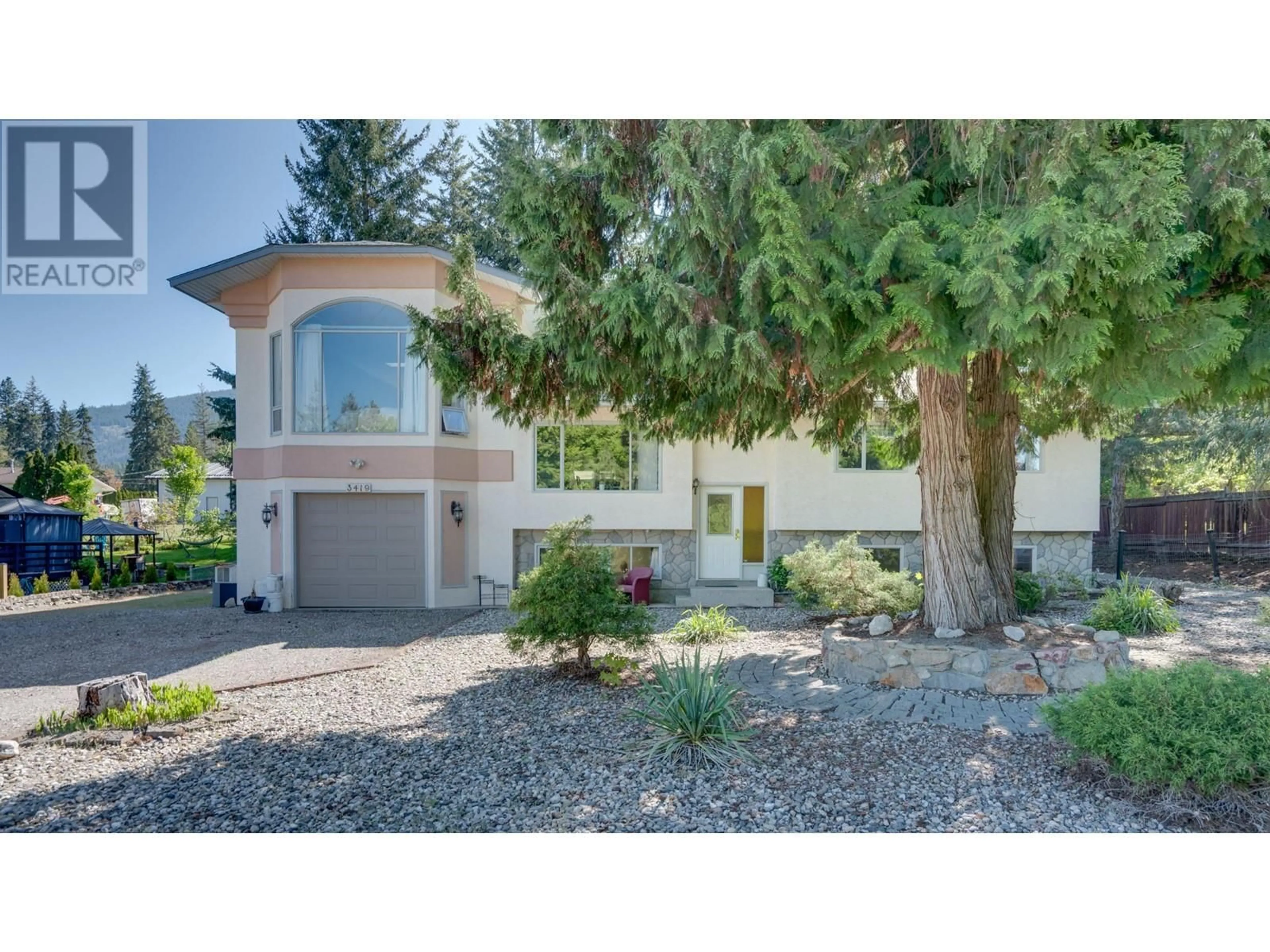 Home with vinyl exterior material, street for 3419 LARCH DRIVE, Armstrong British Columbia V0E1B8