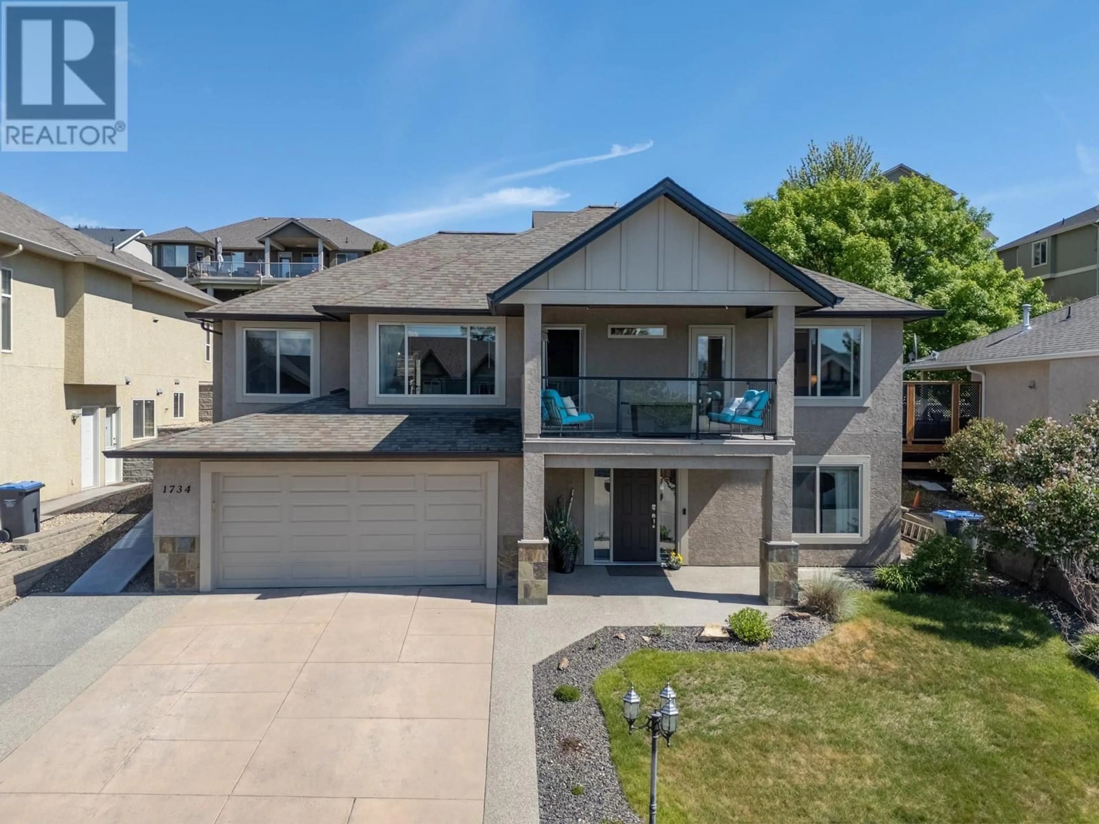 A pic from outside/outdoor area/front of a property/back of a property/a pic from drone, street for 1734 MARKHAM COURT, Kelowna British Columbia V1V2W1