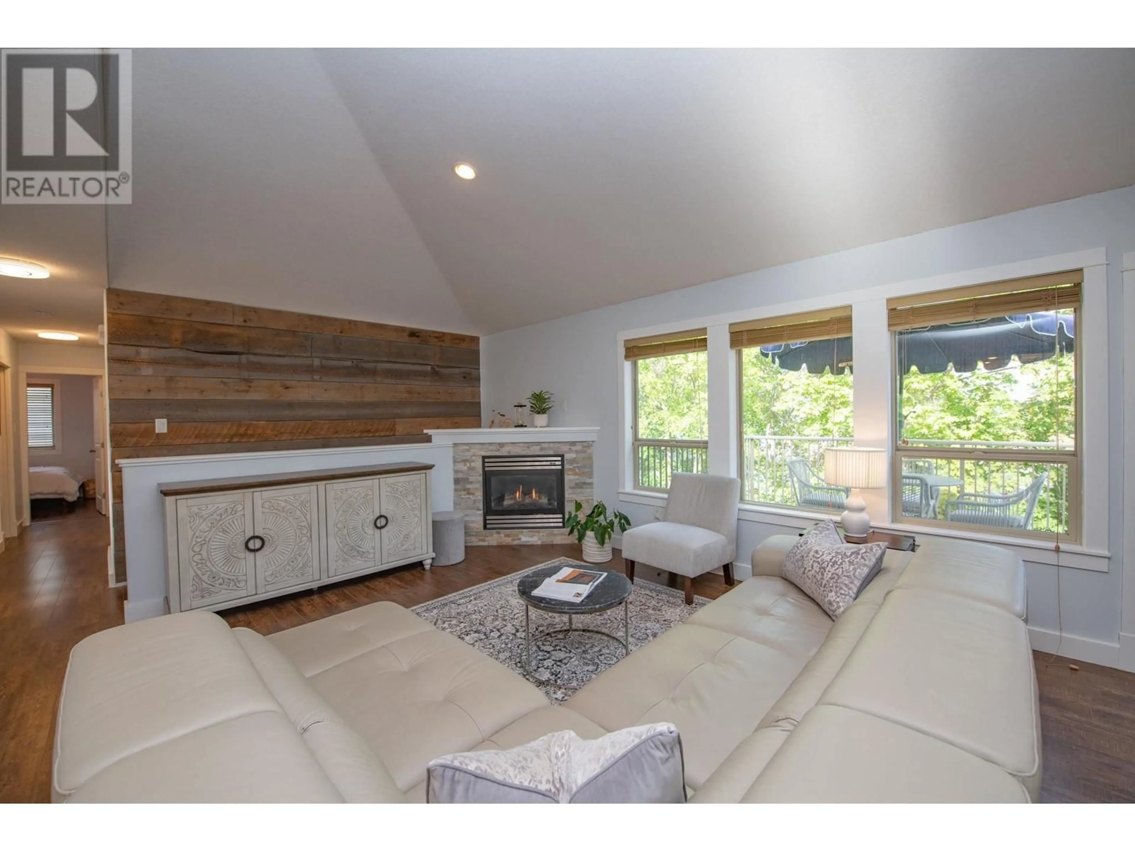 Living room with furniture, wood/laminate floor for 1927 SKYVIEW CRESCENT, Lumby British Columbia V0E2G0
