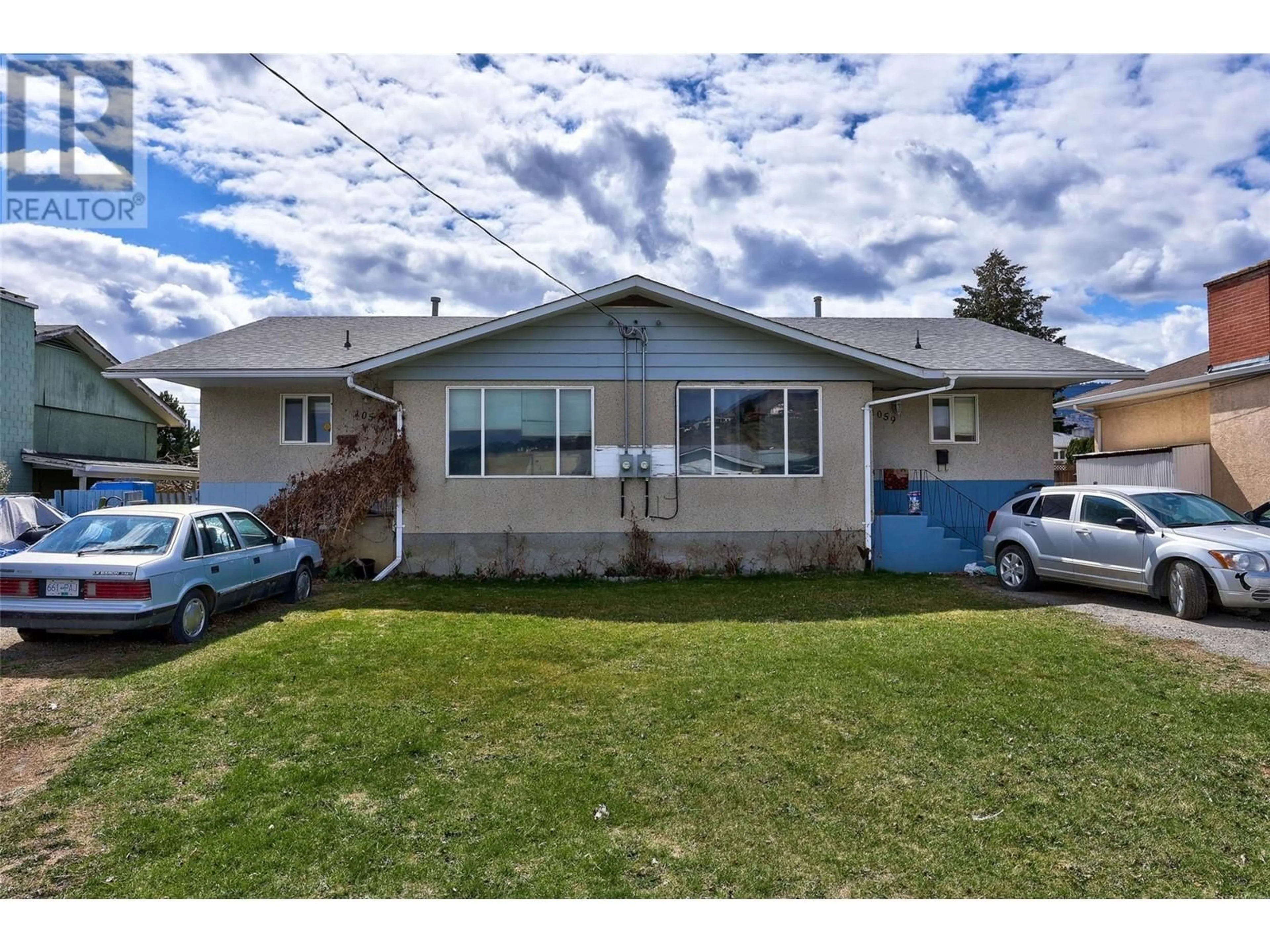 Home with vinyl exterior material, street for 1057/1059 LETHBRIDGE AVENUE, Kamloops British Columbia V2B1Y1
