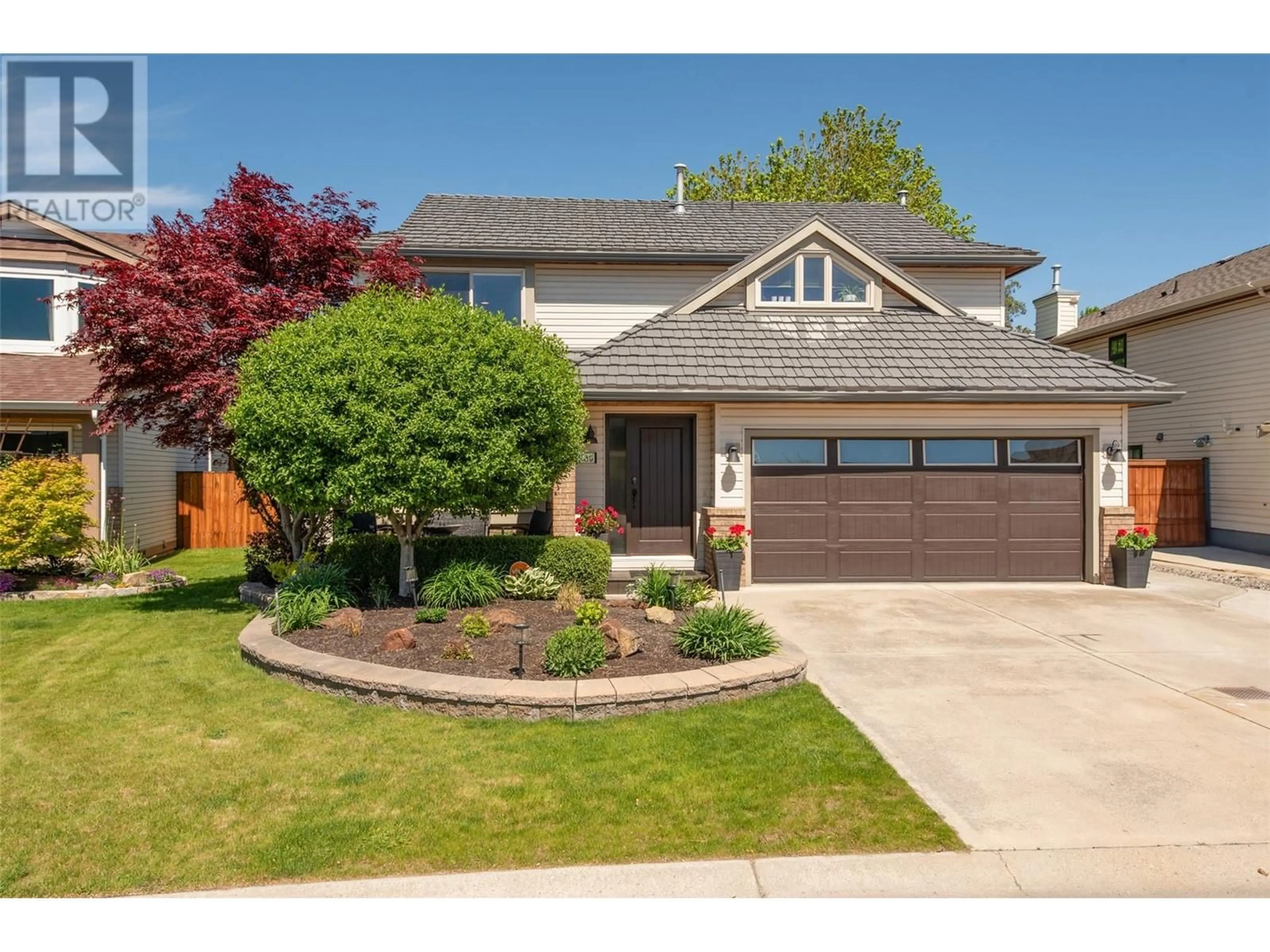 Home with vinyl exterior material, street for 1130 WINTERGREEN CRESCENT, Kelowna British Columbia V1W3V8