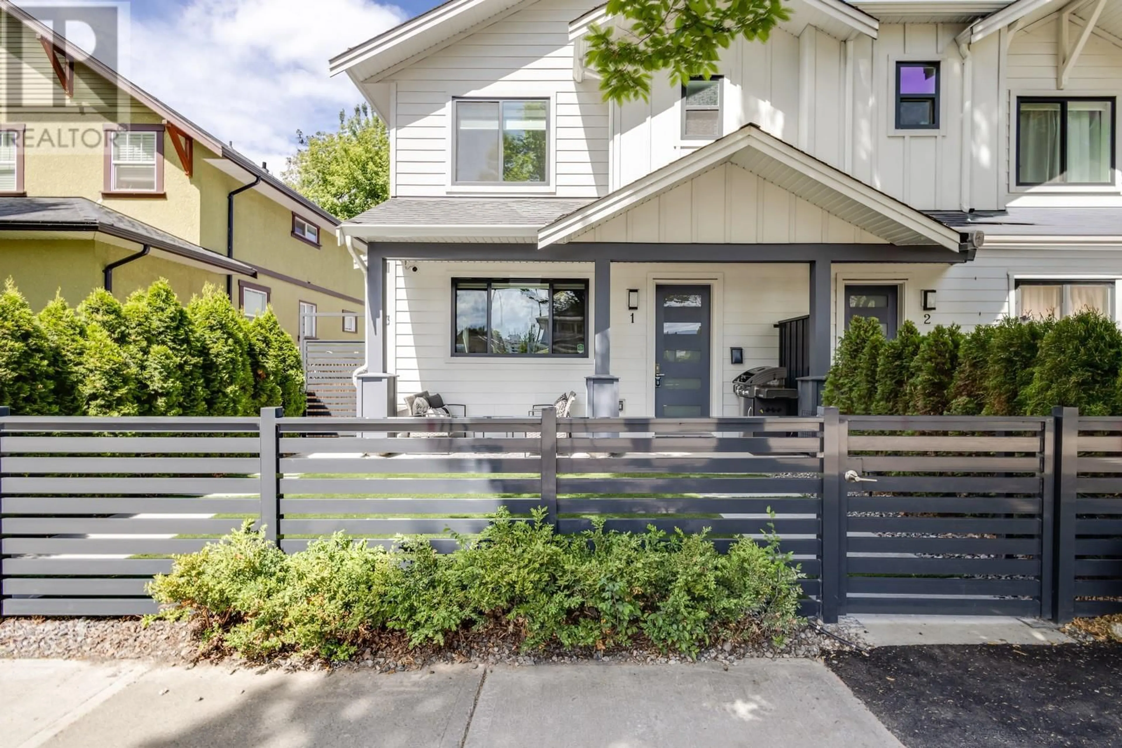 Home with vinyl exterior material, street for 1 - 748 STOCKWELL AVENUE, Kelowna British Columbia V1Y6V9